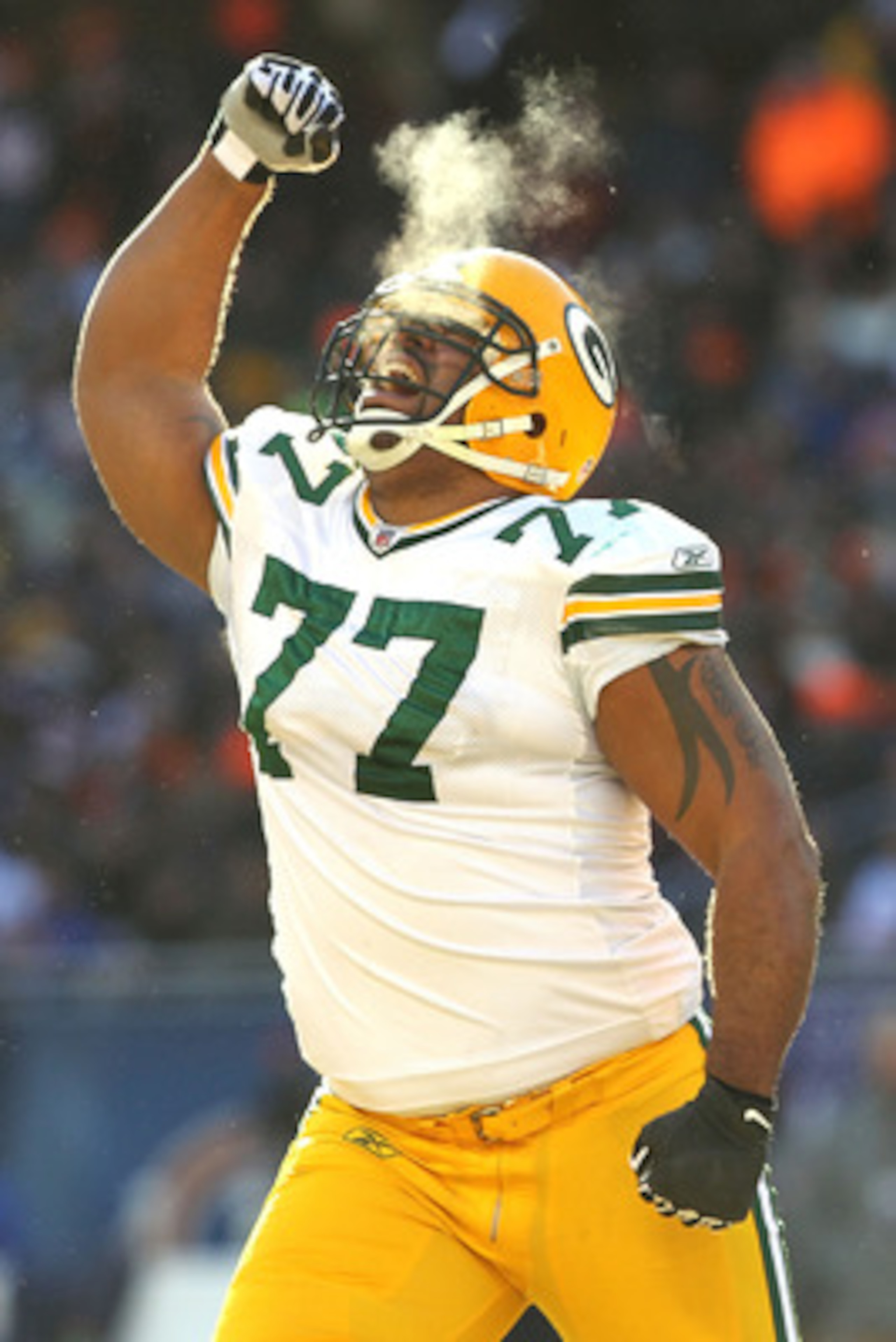 CHICAGO, IL - JANUARY 23:  Cullen Jenkins #77 of the Green Bay Packers reacts after a sack of quarterback Jay Cutler #6 of the Chicago Bears in the first half in the NFC Championship Game at Soldier Field on January 23, 2011 in Chicago, Illinois.  (Photo