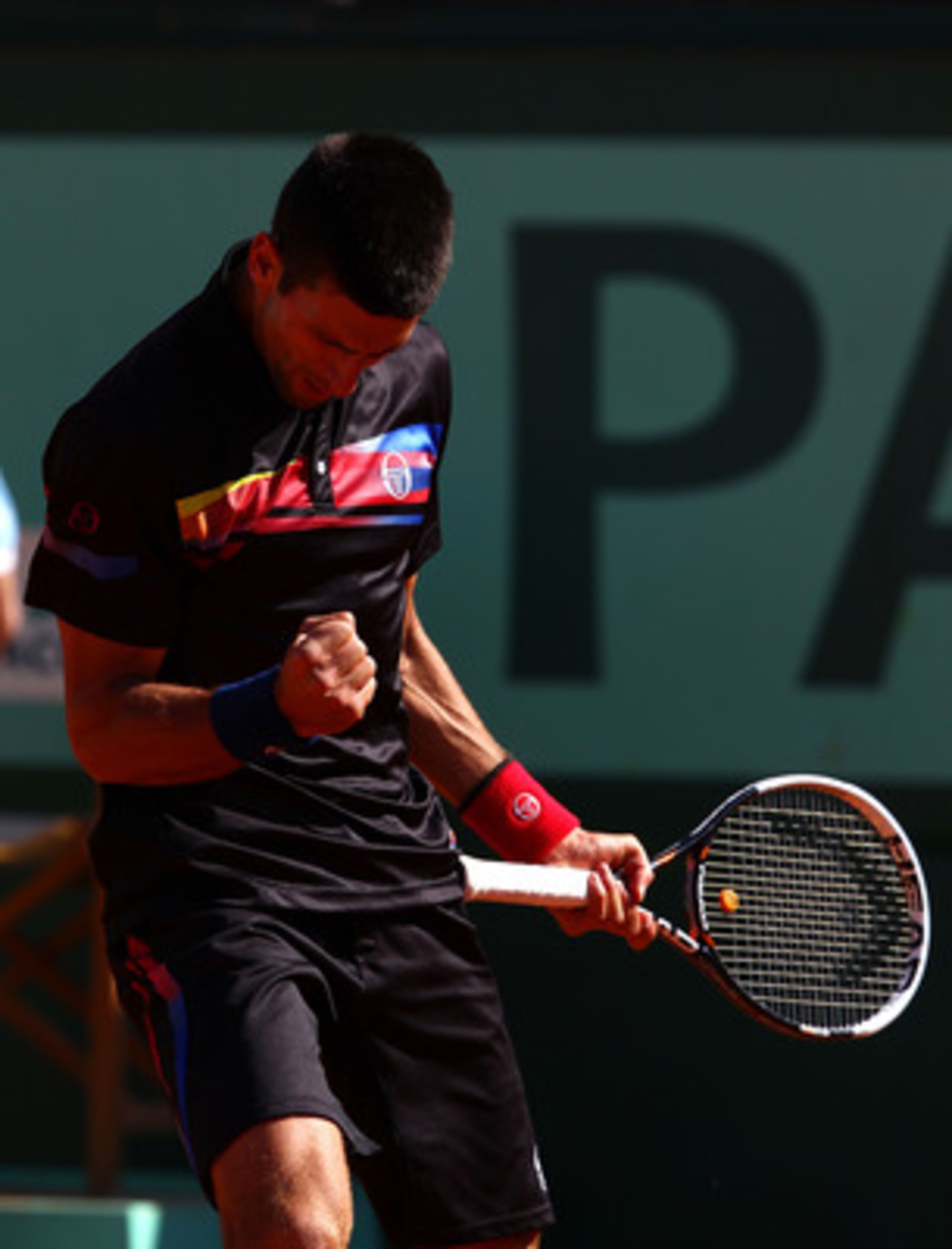 PARIS, FRANCE - MAY 25:  Novak Djokovic of Serbia celebrates a point during the men's singles round two match between Victor Hanescu of Romania and Novak Djokovic of Serbia on day four of the French Open at Roland Garros on May 25, 2011 in Paris, France.