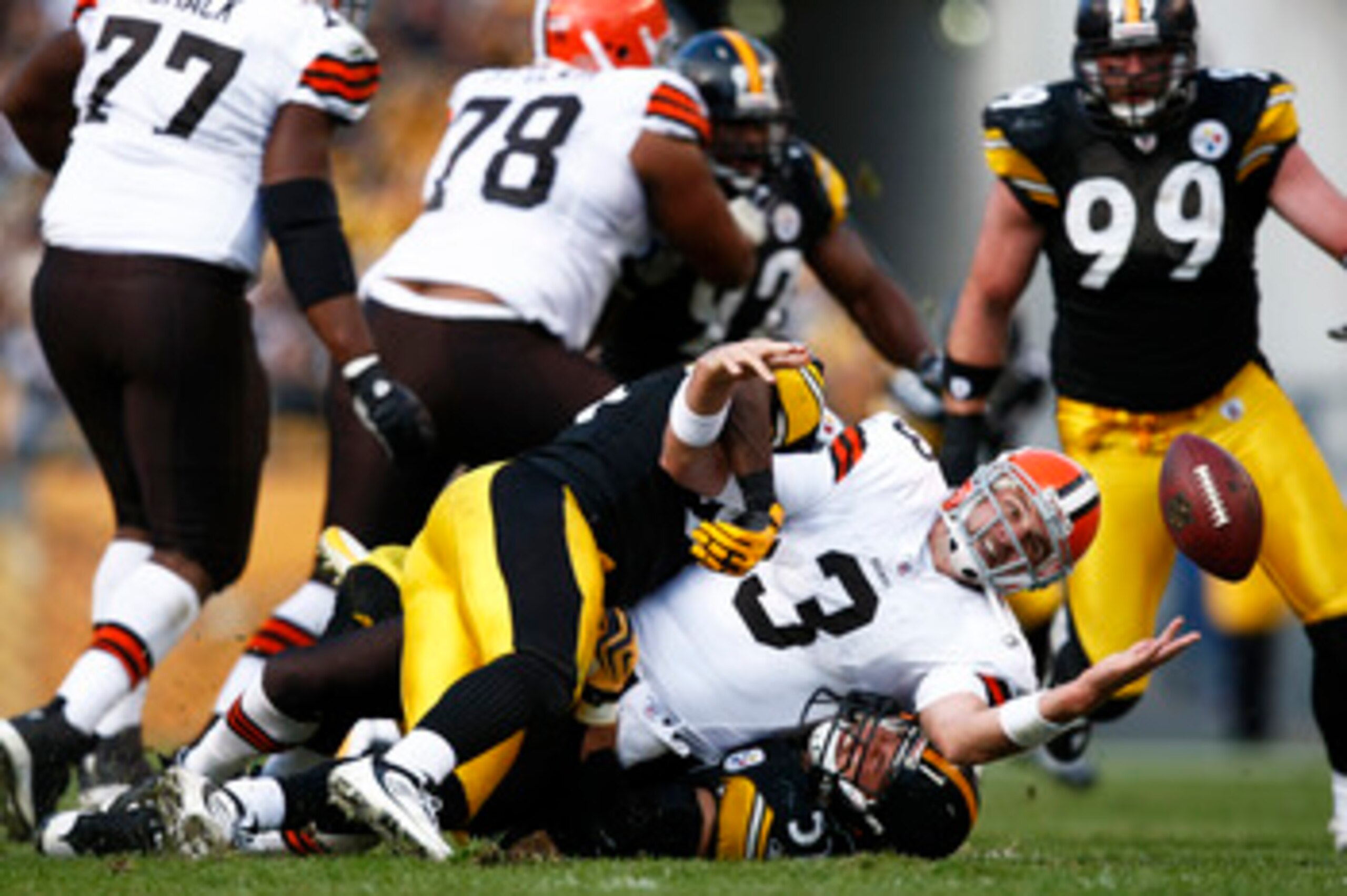 PITTSBURGH, PA - OCTOBER 18: Derek Anderson #3 of the Cleveland Browns fumbles the football after being sacked by James Farrior #51 of the Pittsburgh Steelers at Heinz Field on October 18, 2009 in Pittsburgh, Pennsylvania. The Steelers defeated the Browns