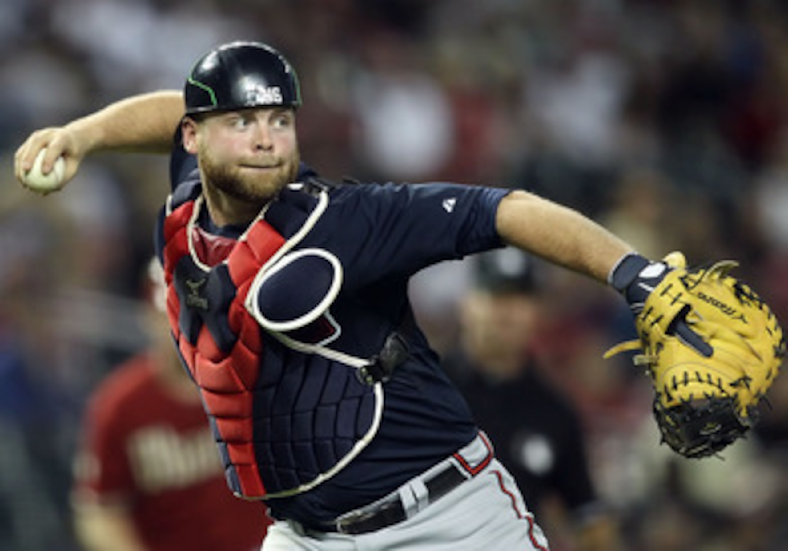 PHOENIX, AZ - MAY 18:  Catcher Brian McCann #16 of the Atlanta Braves in action during the Major League Baseball game against the Arizona Diamondbacks at Chase Field on May 18, 2011 in Phoenix, Arizona.  The Diamondbacks defeated the Braves 5-4 in eleven
