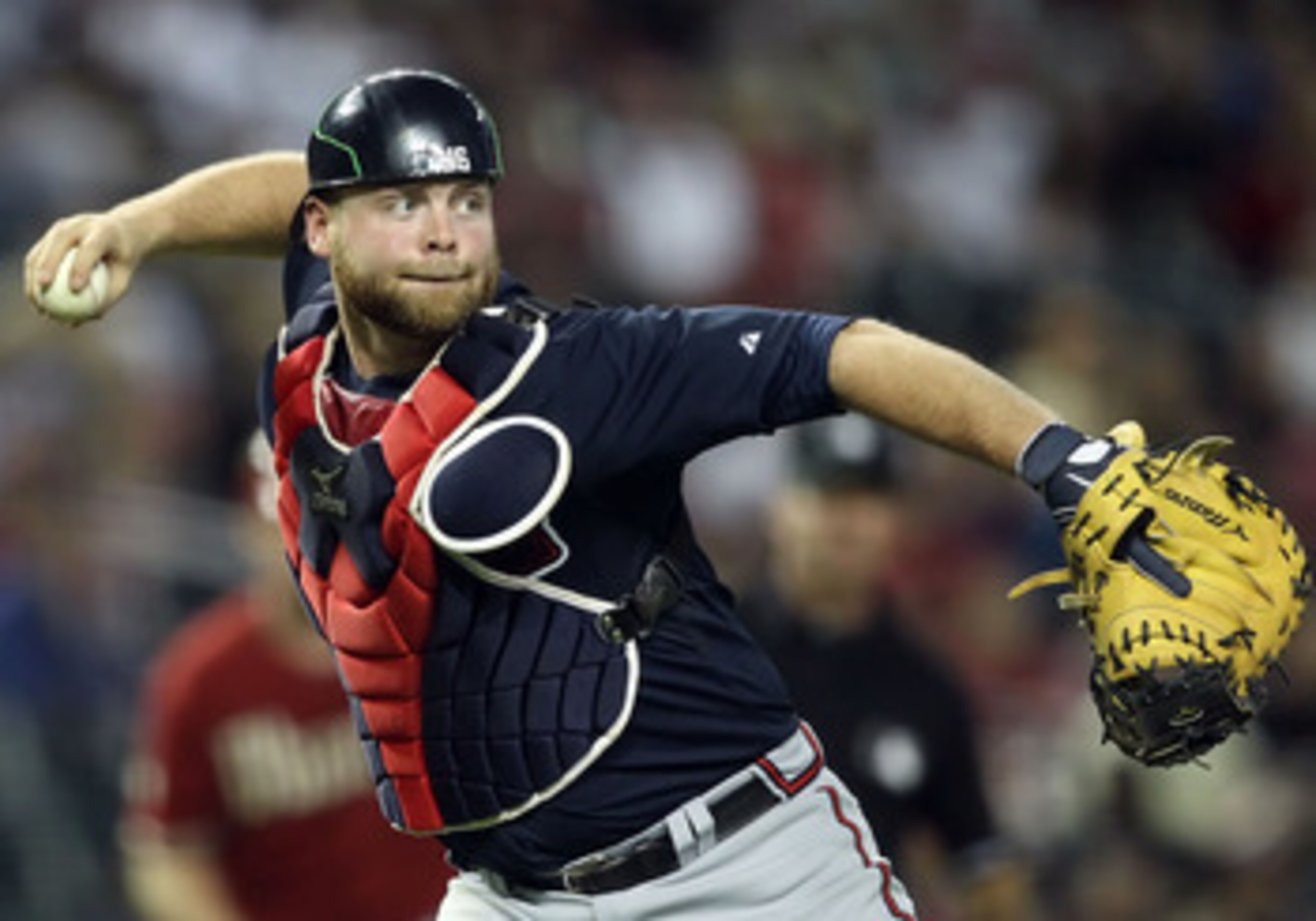 PHOENIX, AZ - MAY 18:  Catcher Brian McCann #16 of the Atlanta Braves in action during the Major League Baseball game against the Arizona Diamondbacks at Chase Field on May 18, 2011 in Phoenix, Arizona.  The Diamondbacks defeated the Braves 5-4 in eleven