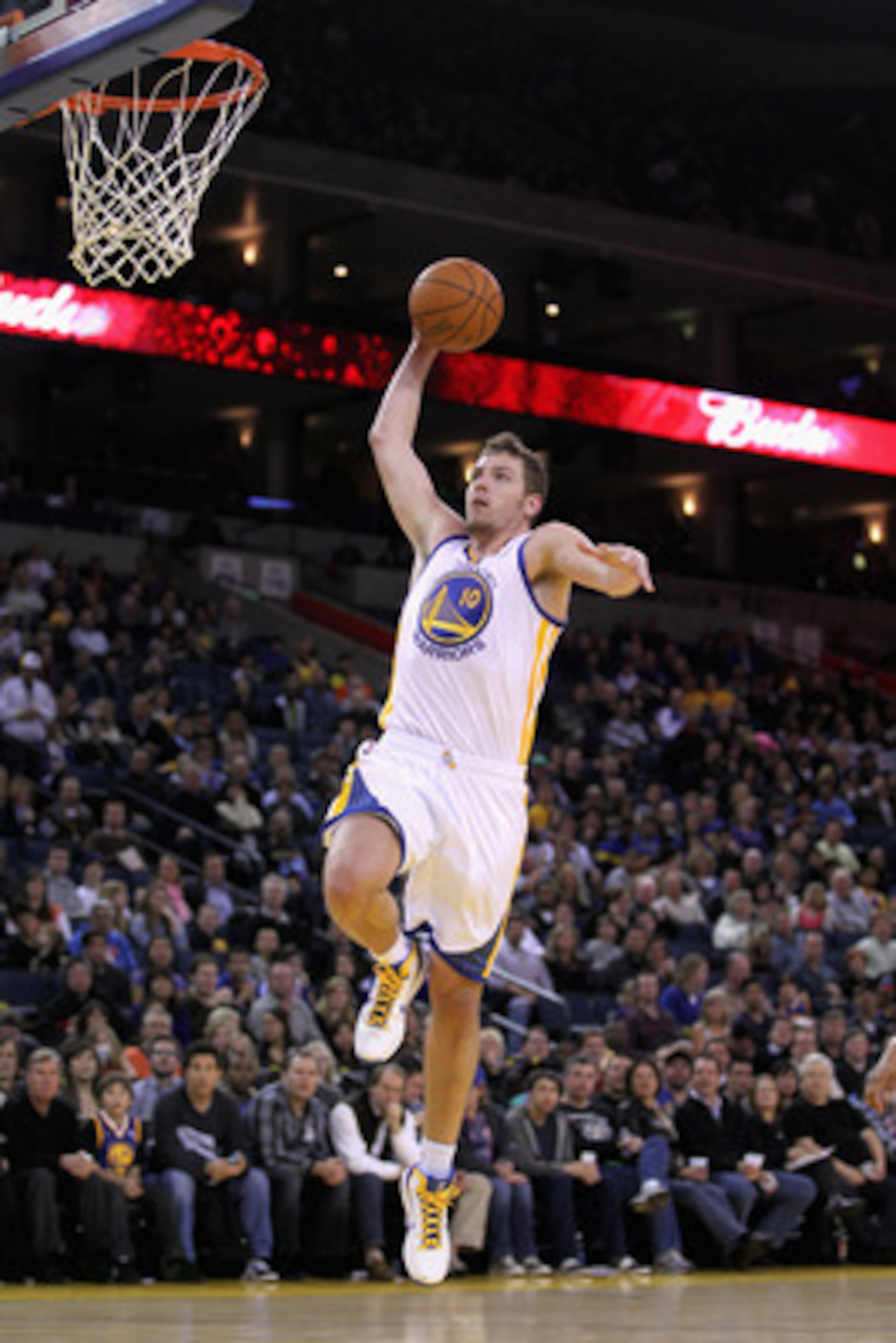 OAKLAND, CA - MARCH 25:  David Lee #10 of the Golden State Warriors in action against the Toronto Raptors at Oracle Arena on March 25, 2011 in Oakland, California. NOTE TO USER: User expressly acknowledges and agrees that, by downloading and or using this