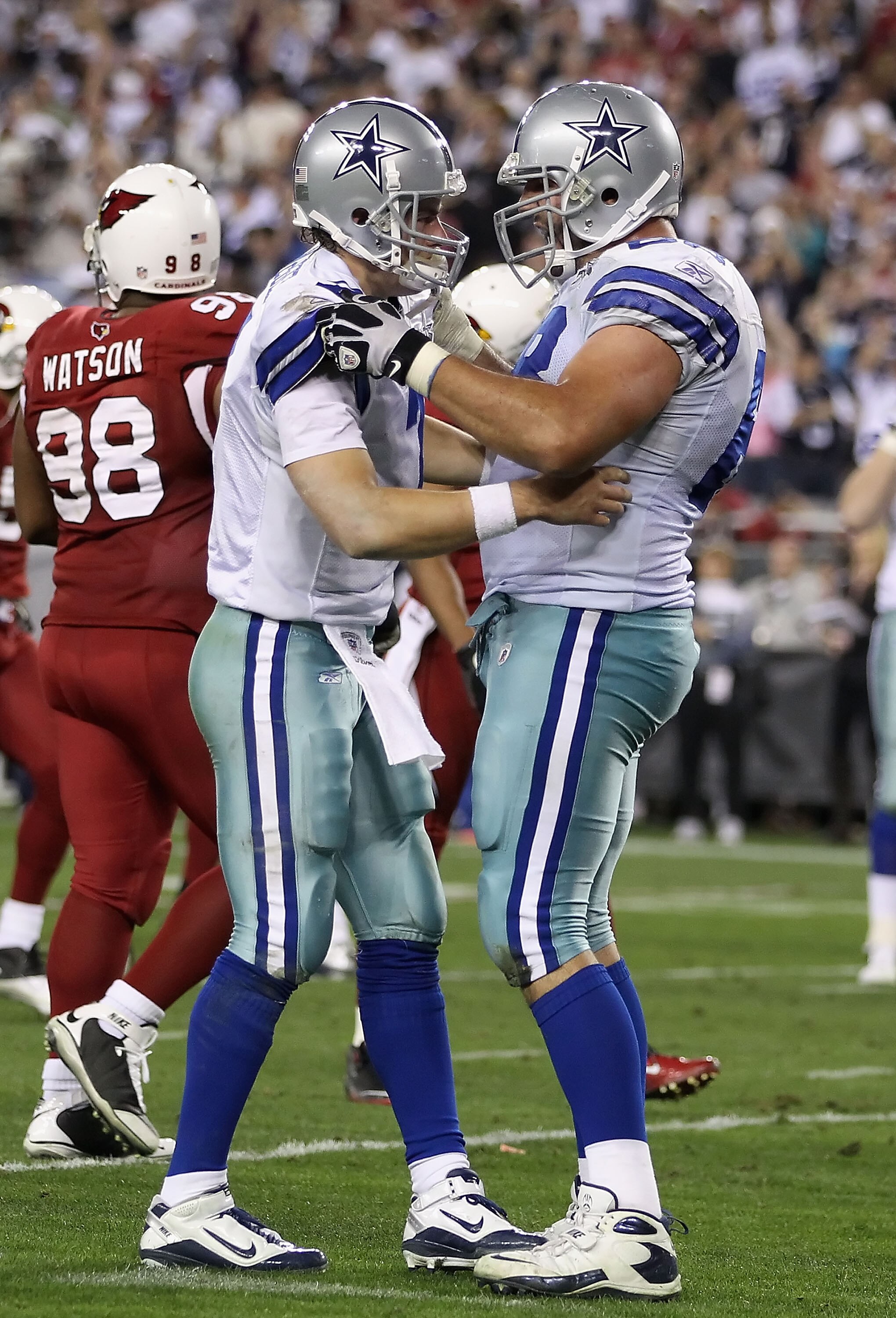 GLENDALE, AZ - DECEMBER 25:  Quarterback Stephen McGee #7 of the Dallas Cowboys reacts with teammate Doug Free #58 after McGee threw a touchdown reception to Miles Austin (not pictured) during the fourth quarter of the NFL game against the Arizona Cardina