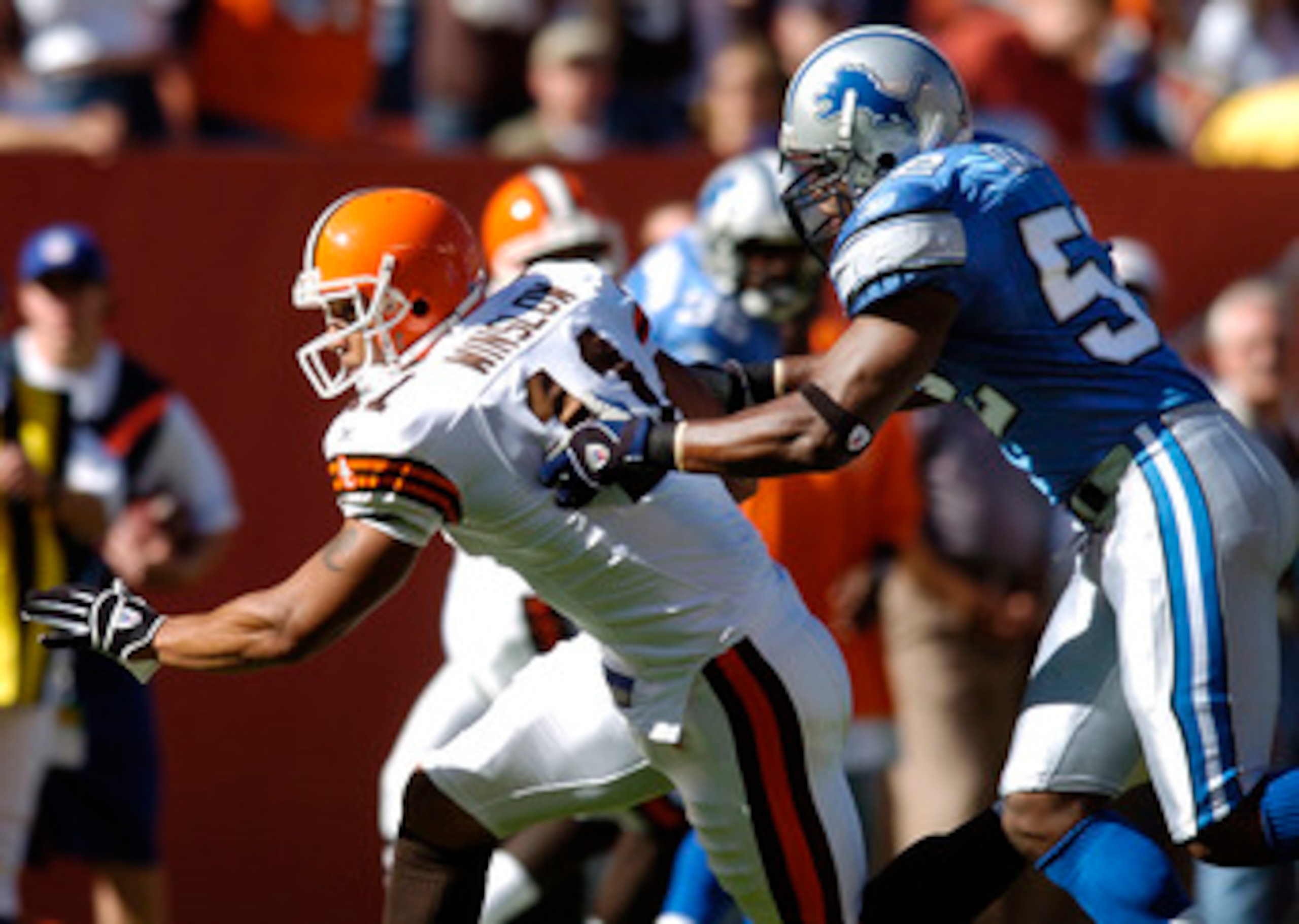 CLEVELAND, OH - AUGUST 21:  Tight end Kellen Winslow Jr. #11 of the Cleveland Browns catches a pass for a first down against linebacker James Davis #52 of the Detroit Lions during their pre-season game on August 21, 2004 at Cleveland Browns Stadium in Cle