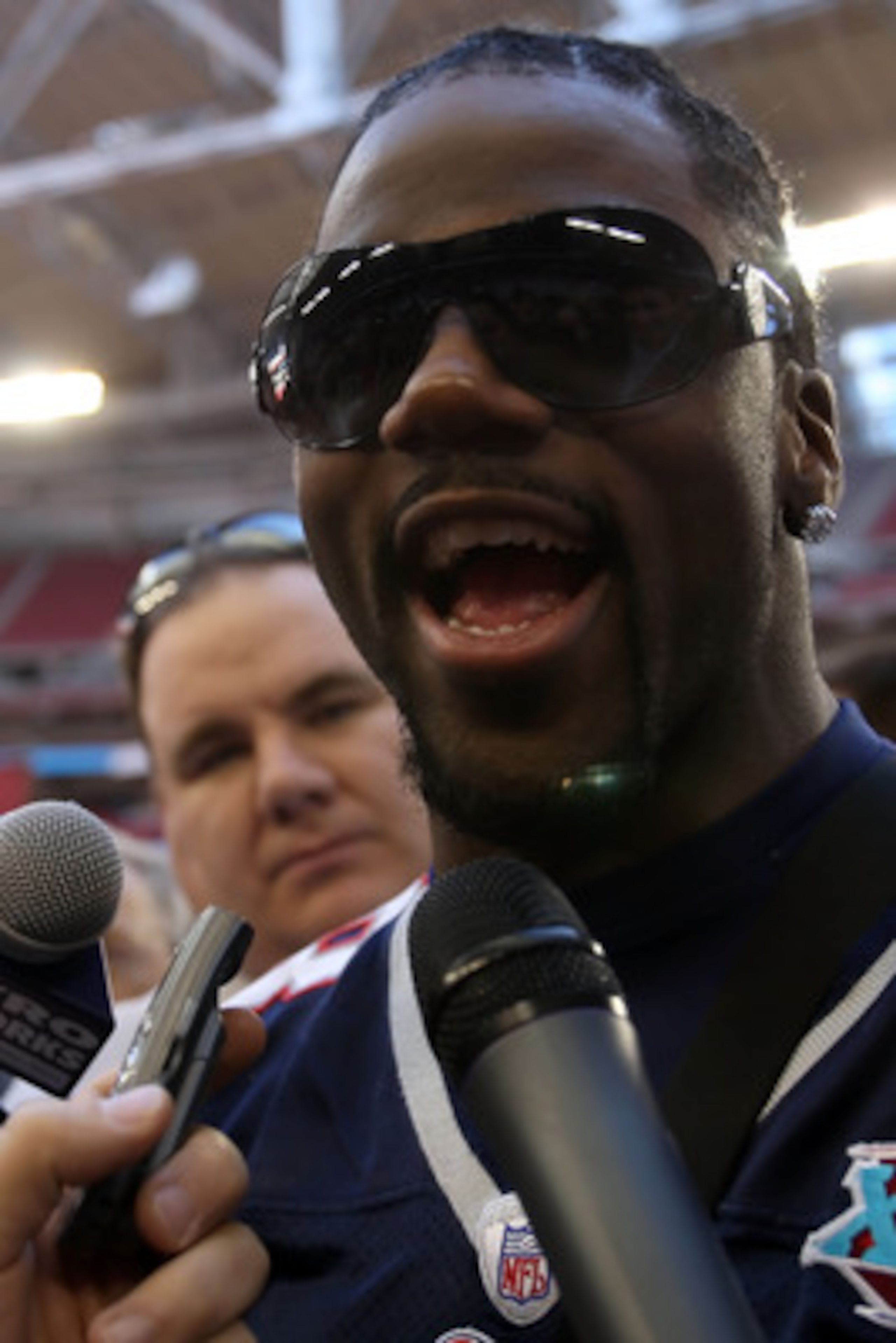 GLENDALE, AZ - JANUARY 29:  Wide receiver Donte' Stallworth #18 of the New England Patriots speaks during Patriots media day for Super Bowl XLII at University of Phoenix Stadium on January 29, 2008 in Glendale, Arizona.  (Photo by Scott Halleran/Getty Ima