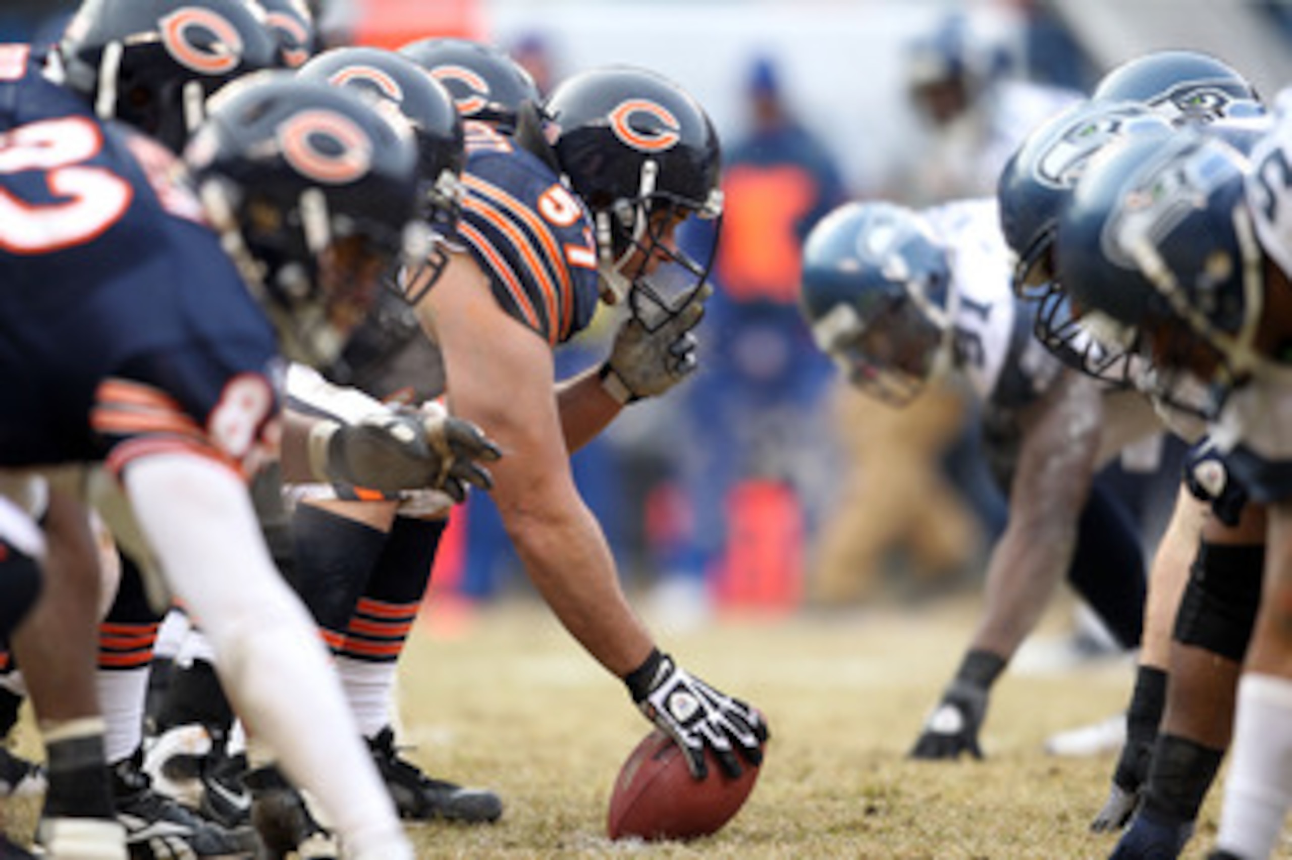 CHICAGO, IL - JANUARY 16:  Center Olin Kreutz #57 of the Chicago Bears prepares to snap the ball against the Seattle Seahawks in the first half in the 2011 NFC divisional playoff game at Soldier Field on January 16, 2011 in Chicago, Illinois.  (Photo by A