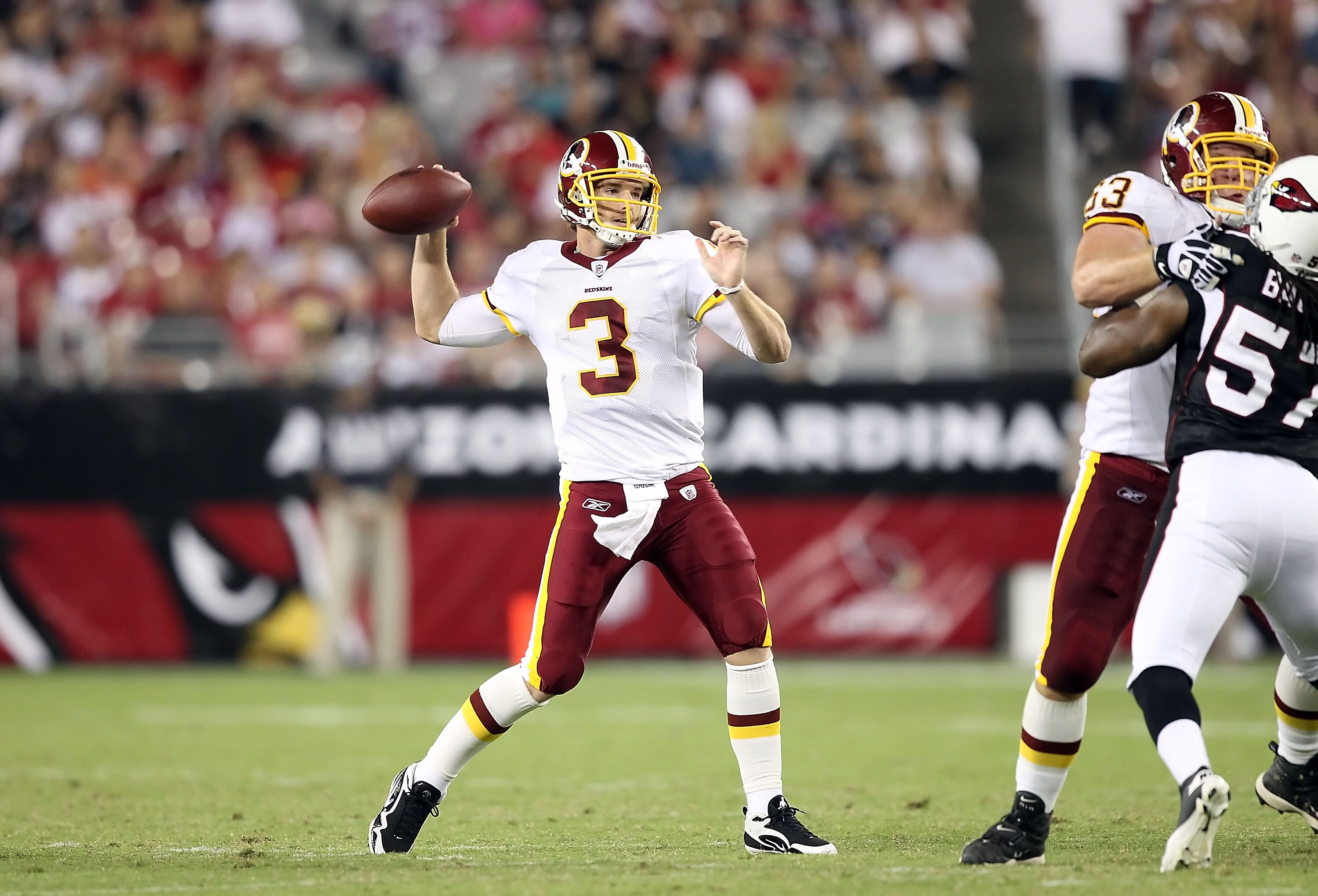 GLENDALE, AZ - SEPTEMBER 02:  Quarterback John Beck #3 of the Washington Redskins drops back to pass during preseason NFL game against the Arizona Cardinals at the University of Phoenix Stadium on September 2, 2010 in Glendale, Arizona. The Cardinals defe
