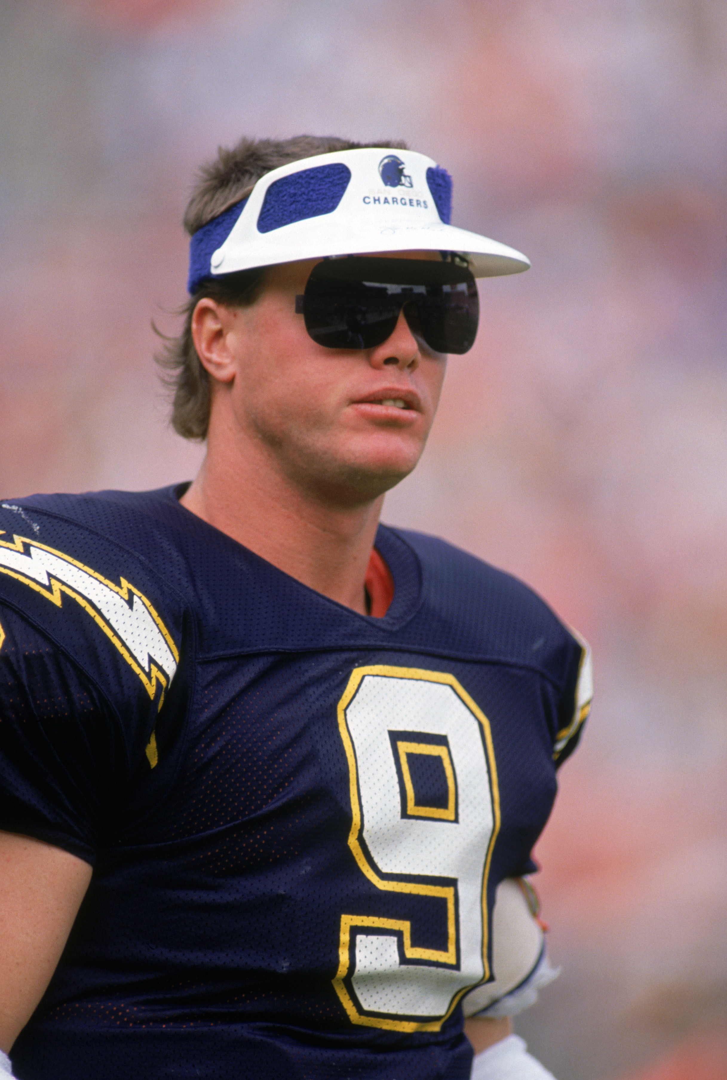 SAN DIEGO - DECEMBER 24:  Quarterback Jim McMahon #9 of the San Diego Chargers looks on during a game against the Denver Broncos at Jack Murphy Stadium on December 24, 1989 in San Diego, California.  The Chargers won 19-16.  (Photo by George Rose/Getty Im
