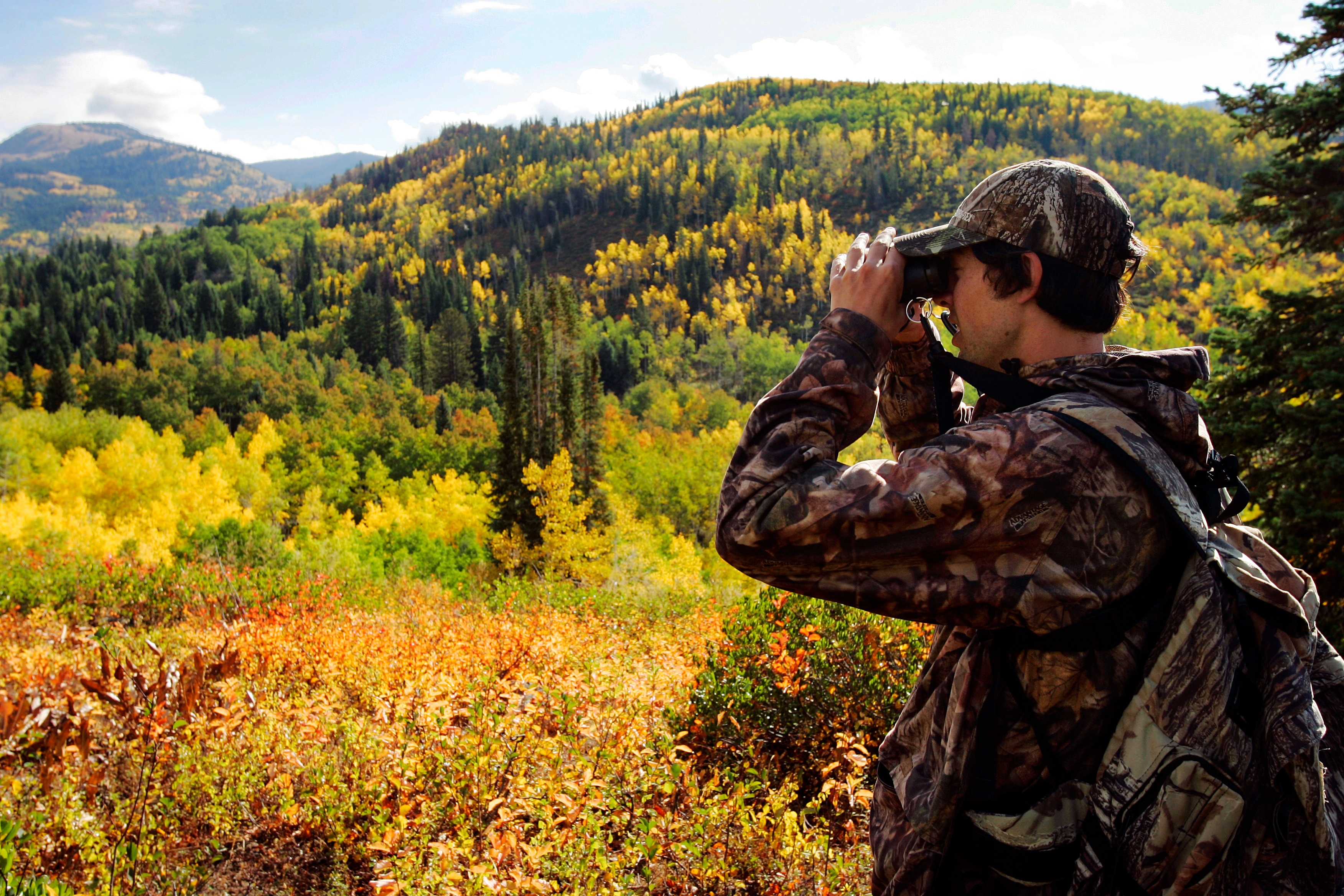 STEAMBOAT - SEPTEMBER 22:  Nordic combined skier Johnny Spillane scouts for elk near Buffalo Pass on September 22, 2005 in Steamboat Springs, Colorado.  Spillane also lives in Park City, Utah.  (Photo by Brian Bahr/Getty Images)