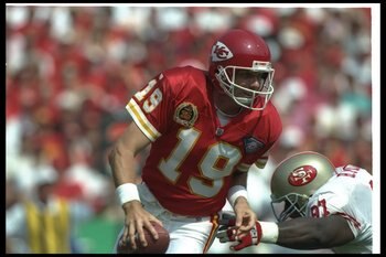 11 Sep 1994:  Quarterback Joe Montana of the Kansas City Chiefs (left) scrambles to avoid San Francisco 49ers defensive lineman Bryant Young during a game at Arrowhead Stadium in Kansas City, Missouri.  The Chiefs won the game, 24-17. Mandatory Credit: Mi