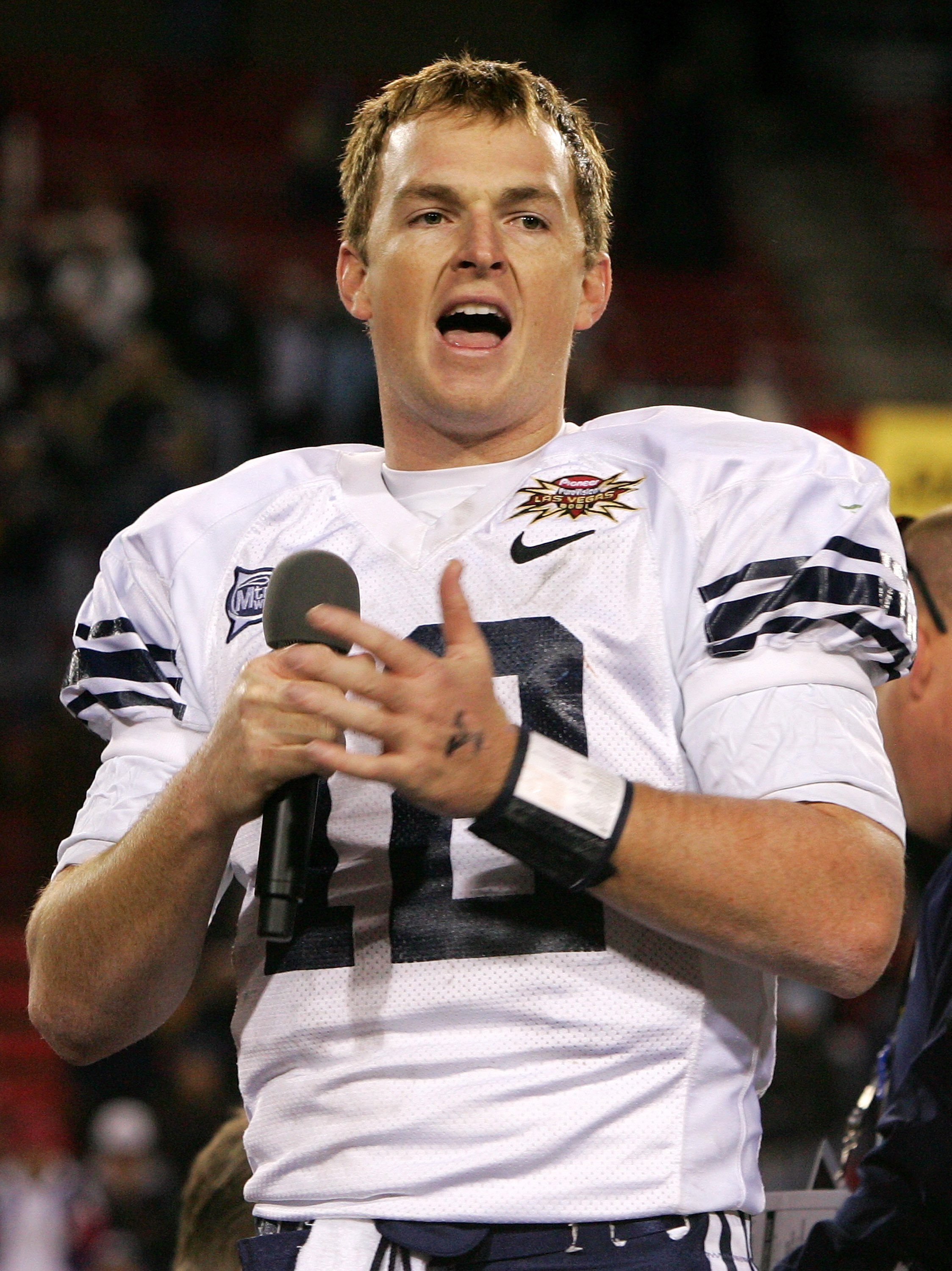 LAS VEGAS - DECEMBER 21:  Brigham Young University quarterback John Beck #12 addresses fans after the Cougars defeated the Oregon Ducks 38-8 in the Pioneer PureVision Las Vegas Bowl at Sam Boyd Stadium December 21, 2006 in Las Vegas, Nevada.  (Photo by Et