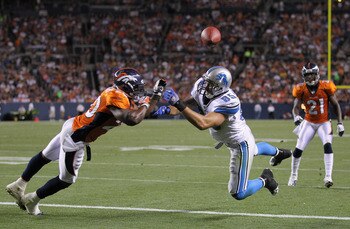 DENVER - AUGUST 21:  Tightend Tony Scheffler #85 of the Detroit Lions is unable to make a reception on the goal line in the second quarter as cornerback Brian Dawkins #20 of the Denver Broncos defends during preseason NFL action at INVESCO Field at Mile H