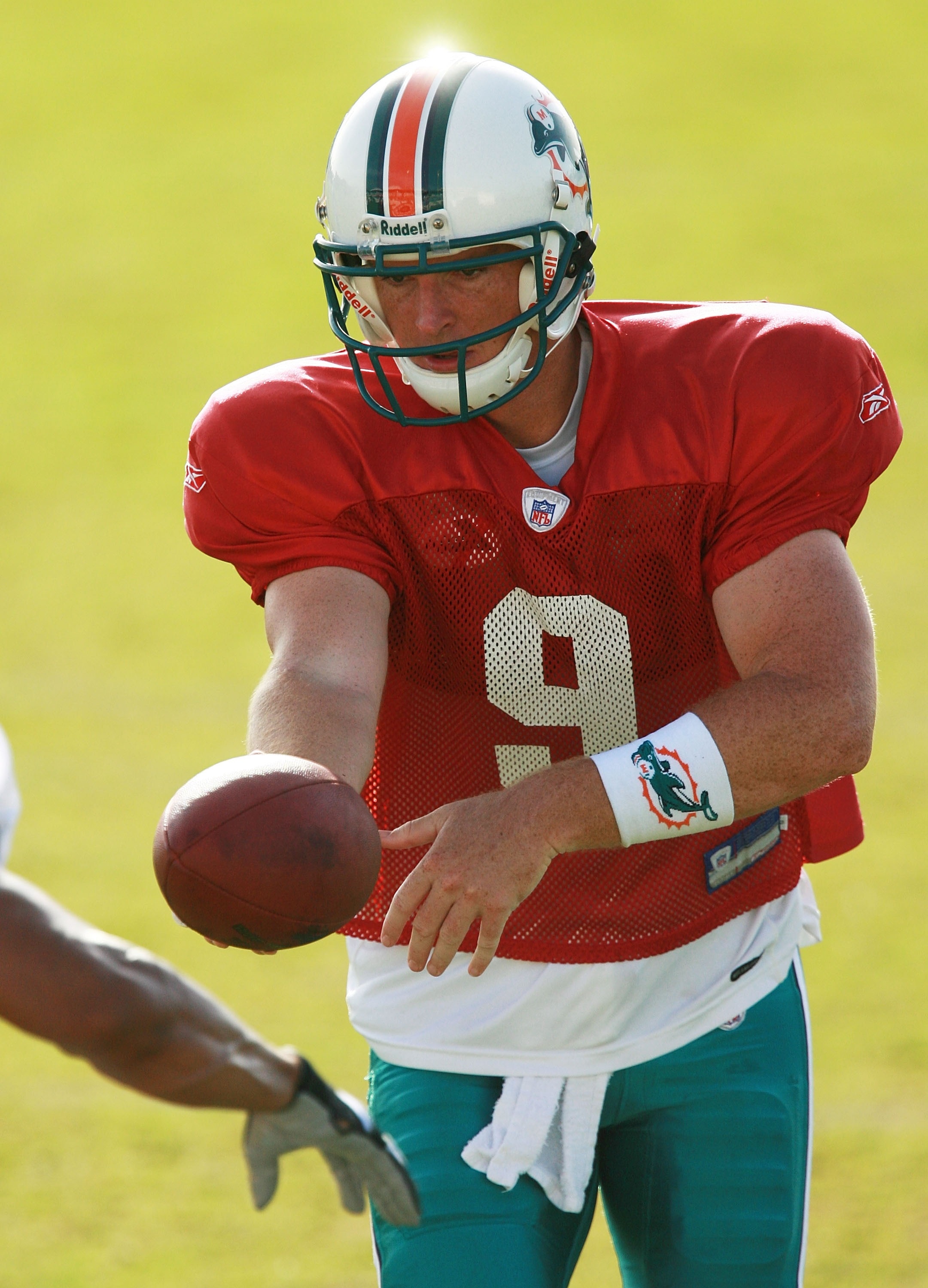 DAVIE, FL - AUGUST 02:  Quarterback John Beck #9 of the Miami Dolphins hands the ball off in practice during training camp at Nova Southeastern University on August 2. 2007 in Davie, Florida.  (Photo by Doug Benc/Getty Images)