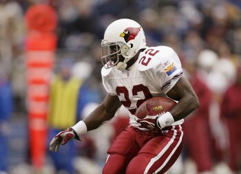 SEATTLE - DECEMBER 26:  Emmitt Smith #22 of the Arizona Cardinals carries the ball during the game against the Seattle Seahawks at Qwest Field on December 26, 2004 in Seattle, Washington. The Seahawks defeated the Cardinals 24-21.  (Photo by Otto Greule J