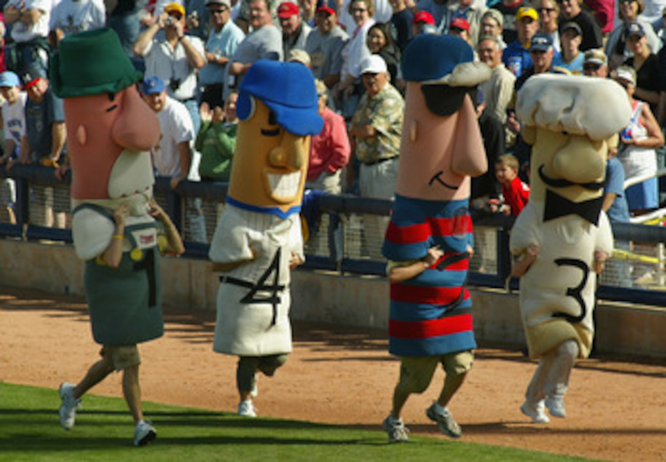 PHOENIX - MARCH 05:  Fans compete in the sausage race during a break from action at the MLB spring training game between the Oakland Athletics and the Milwaukee Brewers at Maryvale Baseball Park on March 5, 2005 in Phoenix, Arizona.  The Brewers won 3-1.