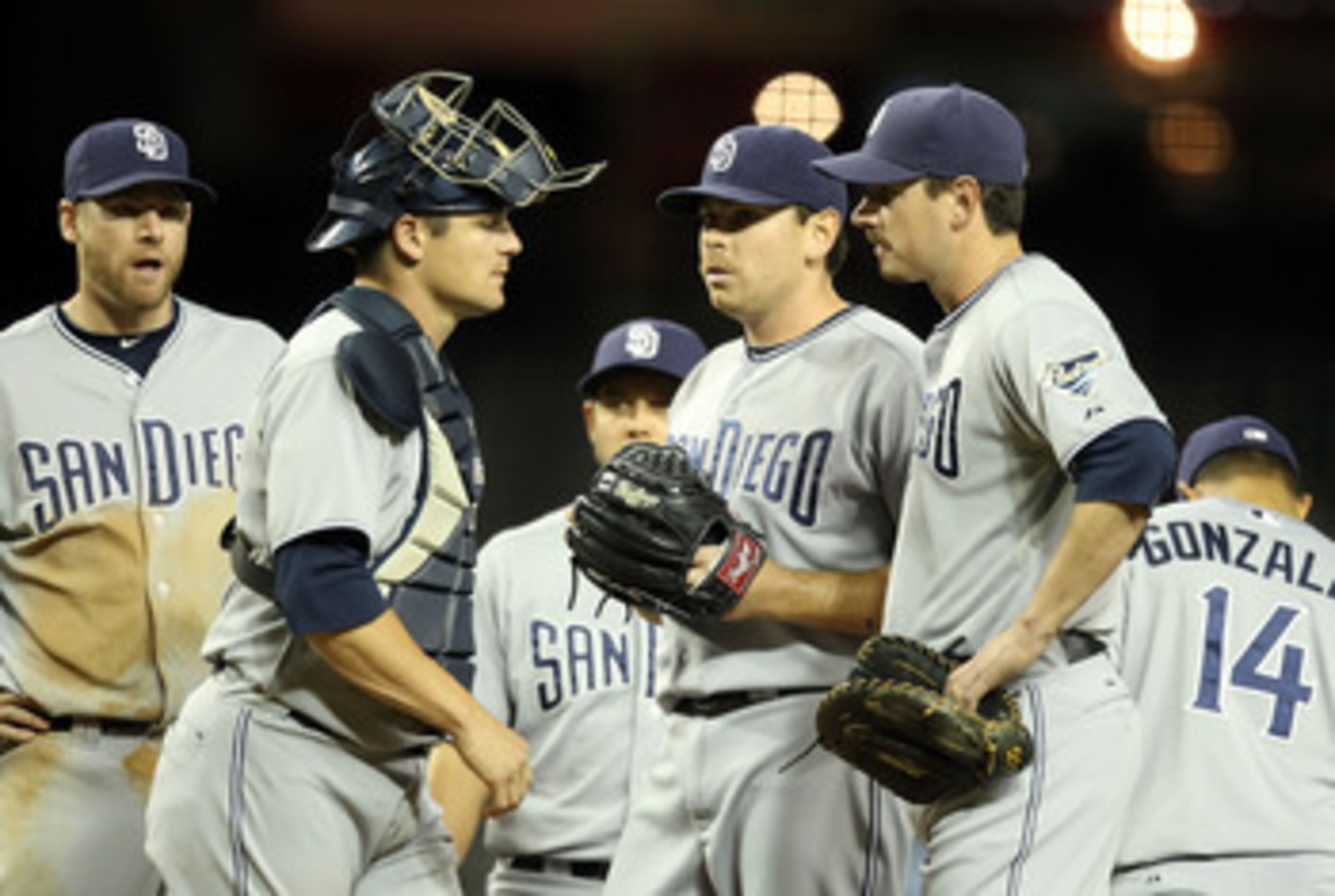 PHOENIX, AZ - MAY 17:  Starting pitcher Tim Stauffer #46 of the San Diego Padres stands on the mound with teammates before being removed from the Major League Baseball game against the Arizona Diamondbacks at Chase Field on May 17, 2011 in Phoenix, Arizon