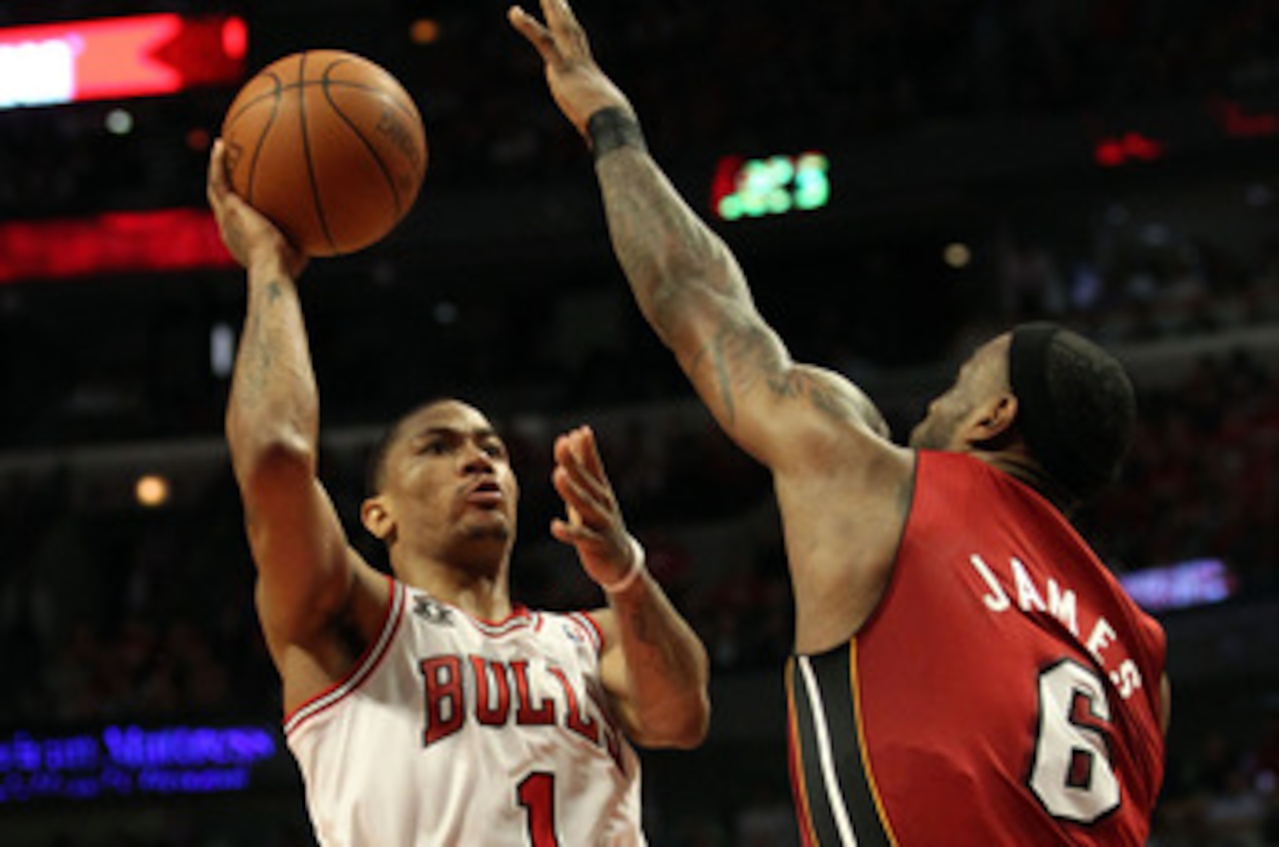 CHICAGO, IL - MAY 26:  Derrick Rose #1 of the Chicago Bulls drives for a shot attempt against LeBron James #6 of the Miami Heat in Game Five of the Eastern Conference Finals during the 2011 NBA Playoffs on May 26, 2011 at the United Center in Chicago, Ill