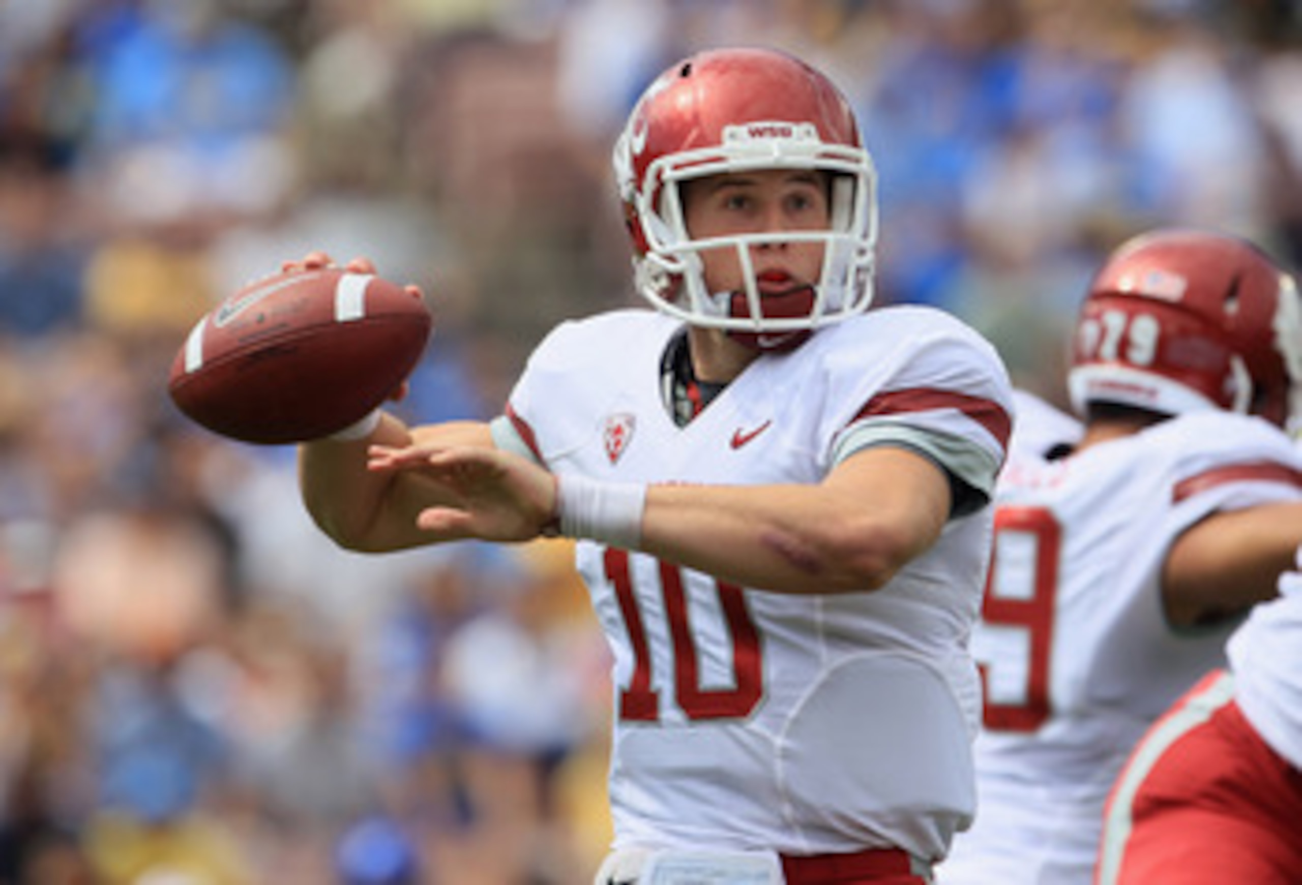 PASADENA, CA - OCTOBER 02:  Quarterback Jeff Tuel #10 of the Washington State Cougars drops back to pass against the  UCLA Bruins during the first quarter at the Rose Bowl on October 2, 2010 in Pasadena, California.  (Photo by Jeff Gross/Getty Images)
