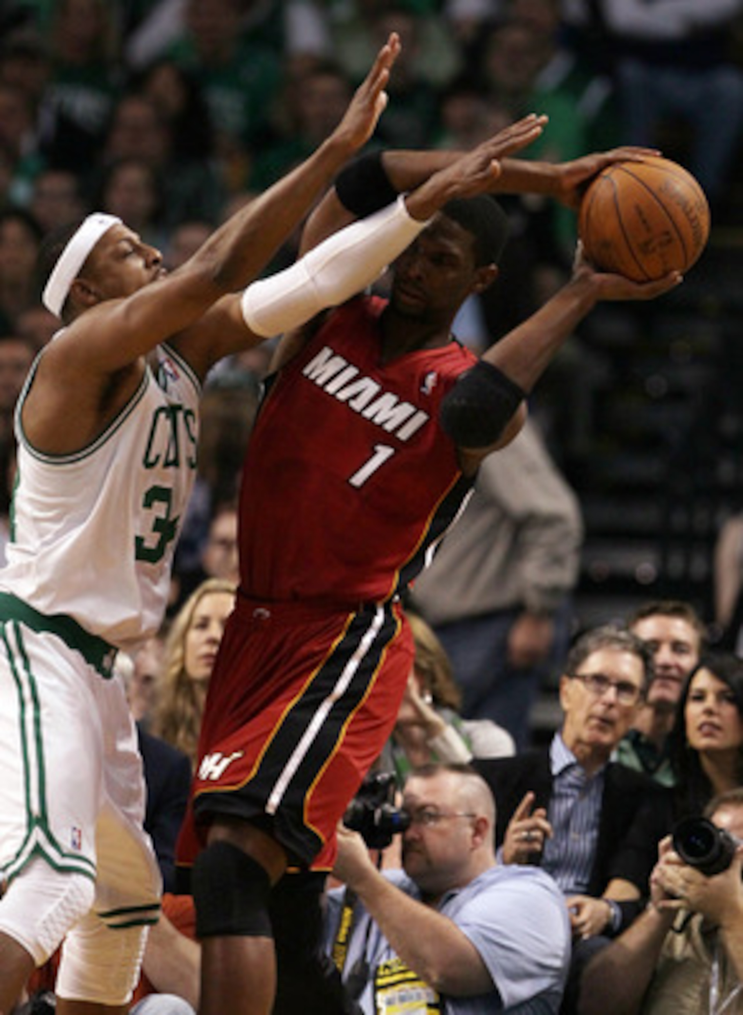 BOSTON, MA - MAY 07:  Chris Bosh #1 of the Miami Heat tries to get around Paul Pierce #34 of the Boston Celtics  in Game Three of the Eastern Conference Semifinals in the 2011 NBA Playoffs on May 7, 2011 at the TD Garden in Boston, Massachusetts.  NOTE TO
