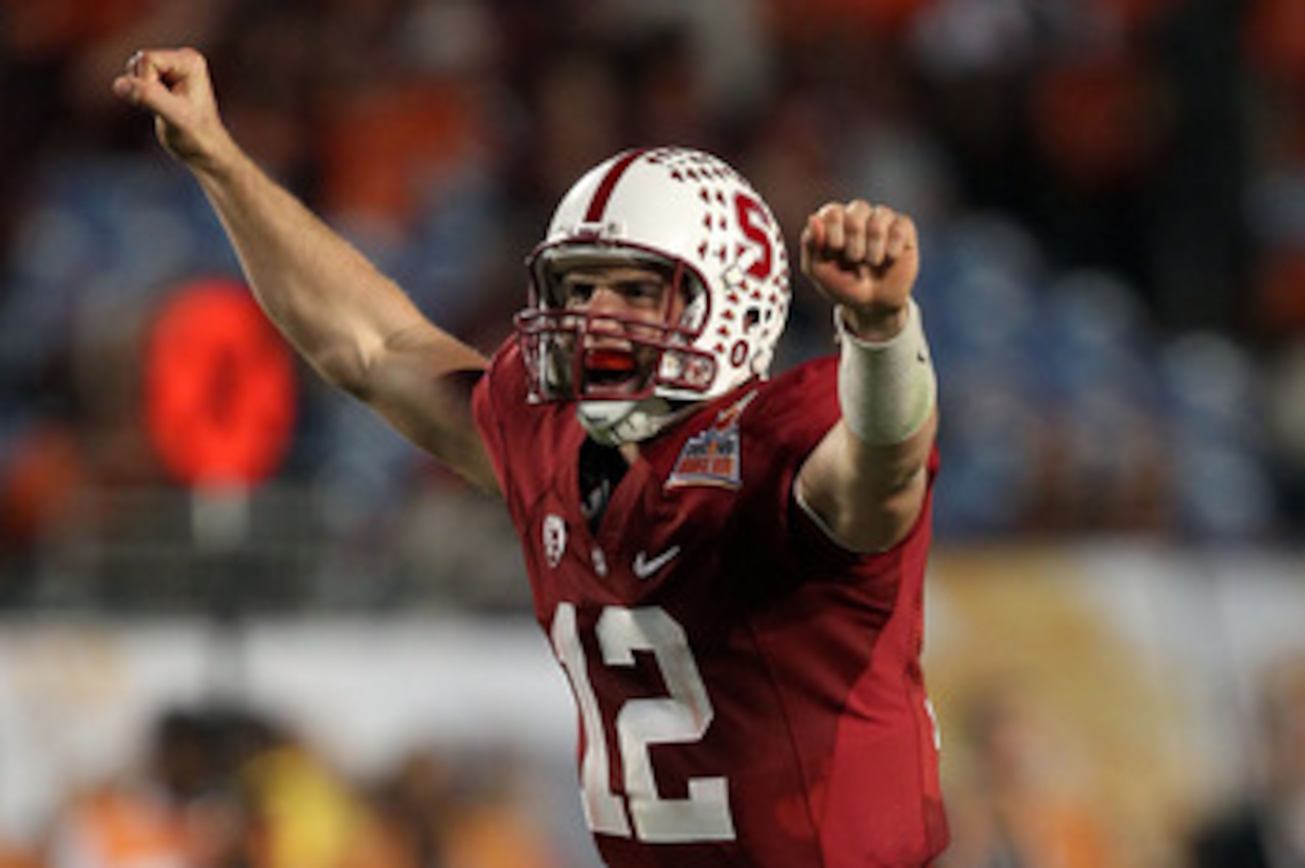 MIAMI, FL - JANUARY 03: Andrew Luck #12 of the Stanford Cardinal celebrates after he threw a 38-yard touchdown pass in the fourth quarter against the Virginia Tech Hokies during the 2011 Discover Orange Bowl at Sun Life Stadium on January 3, 2011 in Miami