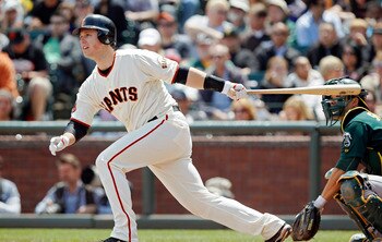 SAN FRANCISCO, CA - MAY 22:  Buster Posey #28 of the San Francisco Giants singles to left field against the Oakland A's  in the third inning at AT&T Park on May 22, 2011 in San Francisco, California.  The Giants won 5-4 in 11 innings.  (Photo by Brian Bah