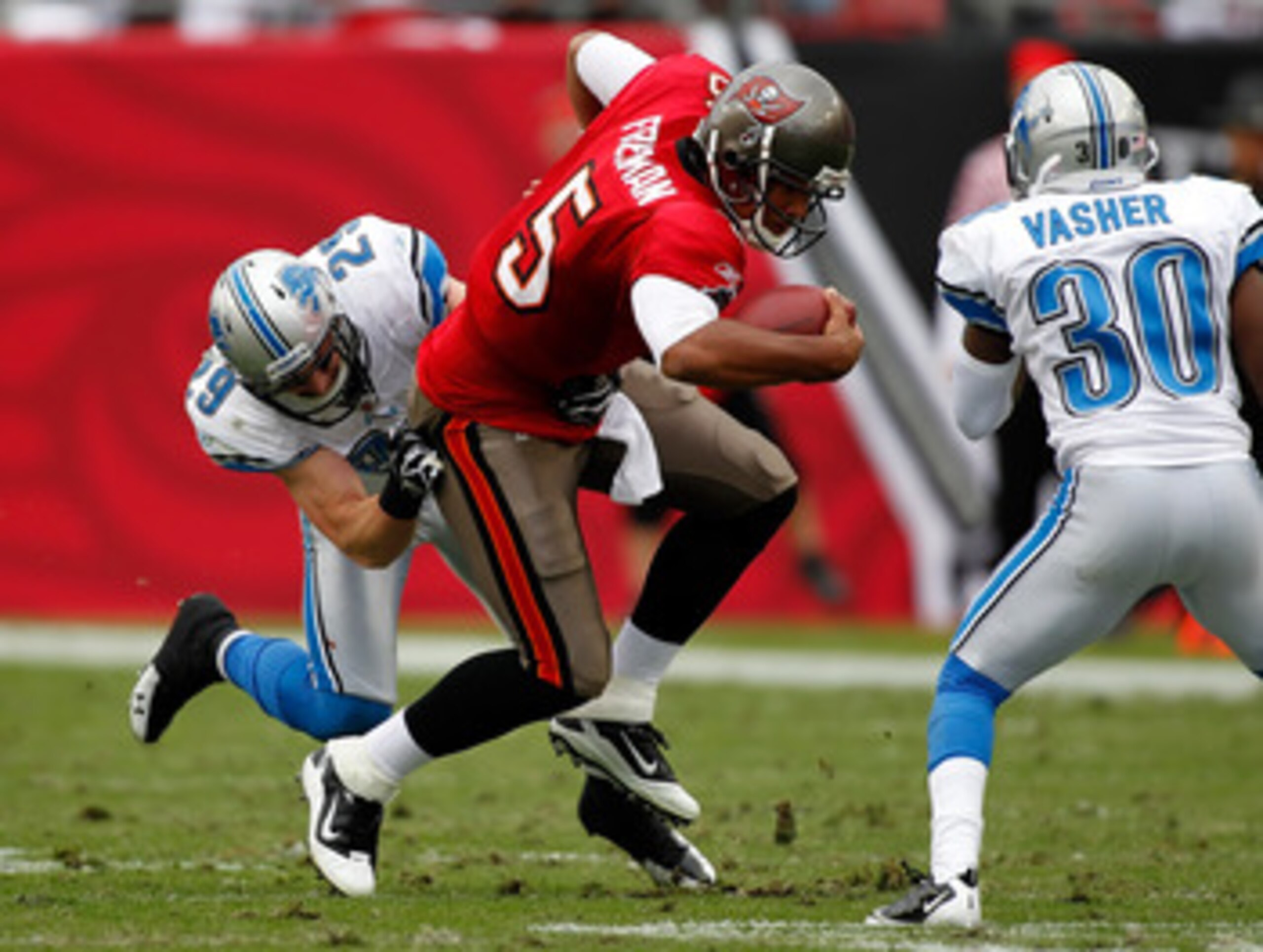 TAMPA, FL - DECEMBER 19:  Safety John Wendling #29 of the Detroit Lions tackles quarterback Josh Freeman #5 of the Tampa Bay Buccaneers during the game at Raymond James Stadium on December 19, 2010 in Tampa, Florida.  (Photo by J. Meric/Getty Images)