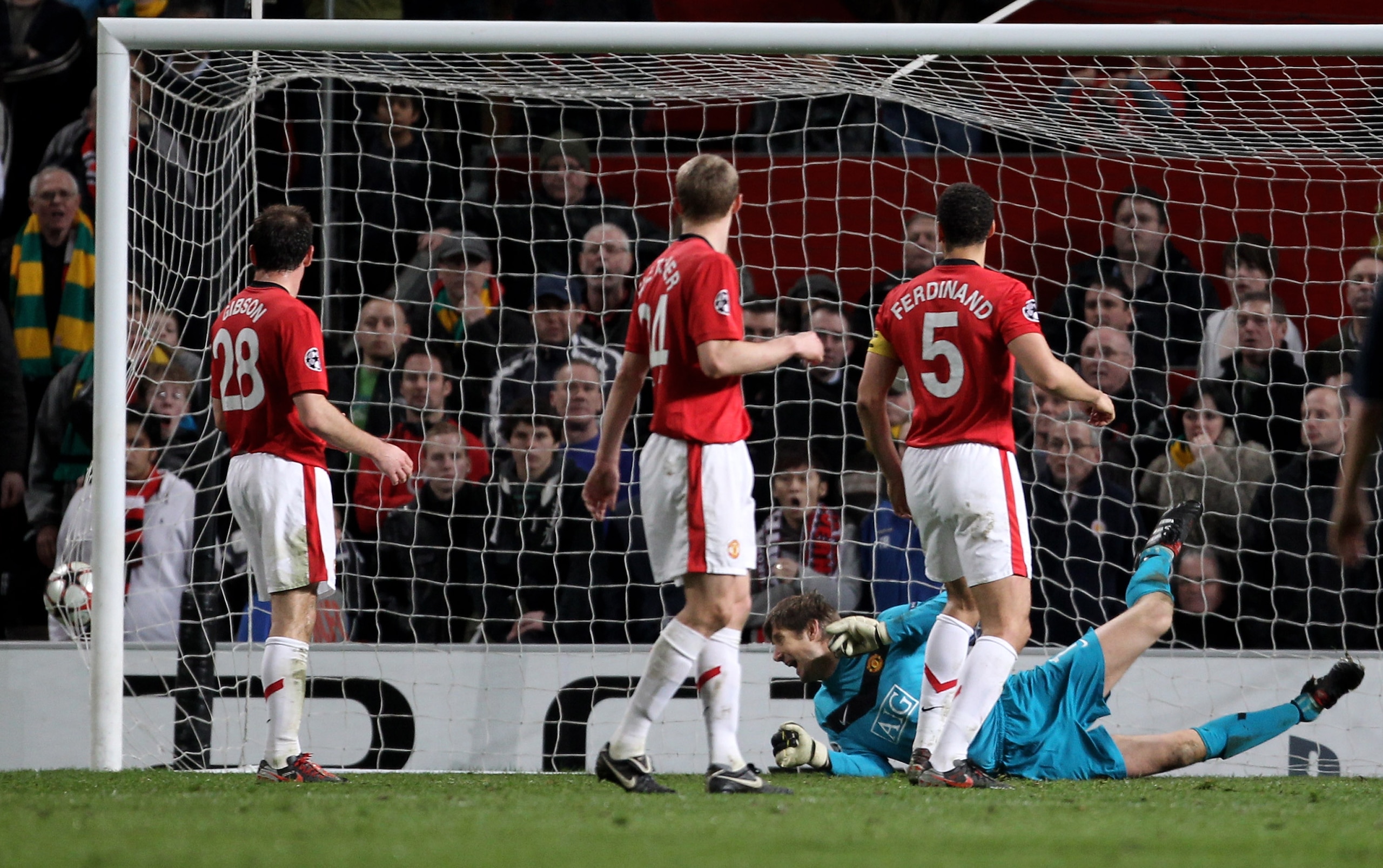 MANCHESTER, ENGLAND - APRIL 07:   Edwin van der Sar of Manchester United watches the ball hit the back of the net as Arjen Robben of Bayern Muenchen scores his team's second goal during the UEFA Champions League Quarter Final second leg match between Manc