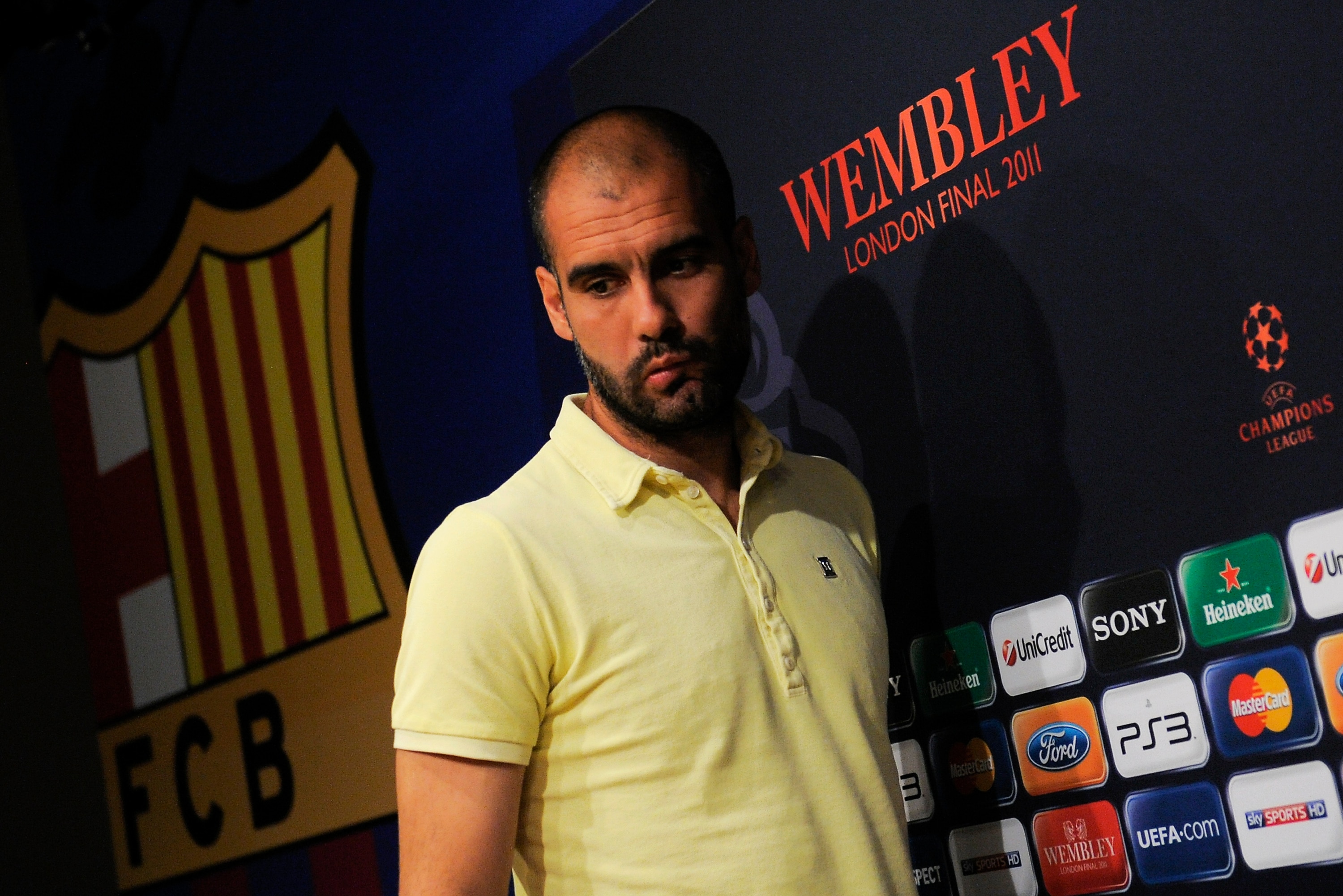 BARCELONA, SPAIN - MAY 23:  Coach Josep Guardiola of Barcelona arrives to the press conference prior to the FC Barcelona training session held ahead of next Saturday's UEFA Champions League Final at the Camp Nou Stadium on May 23, 2011 in Barcelona, Spain
