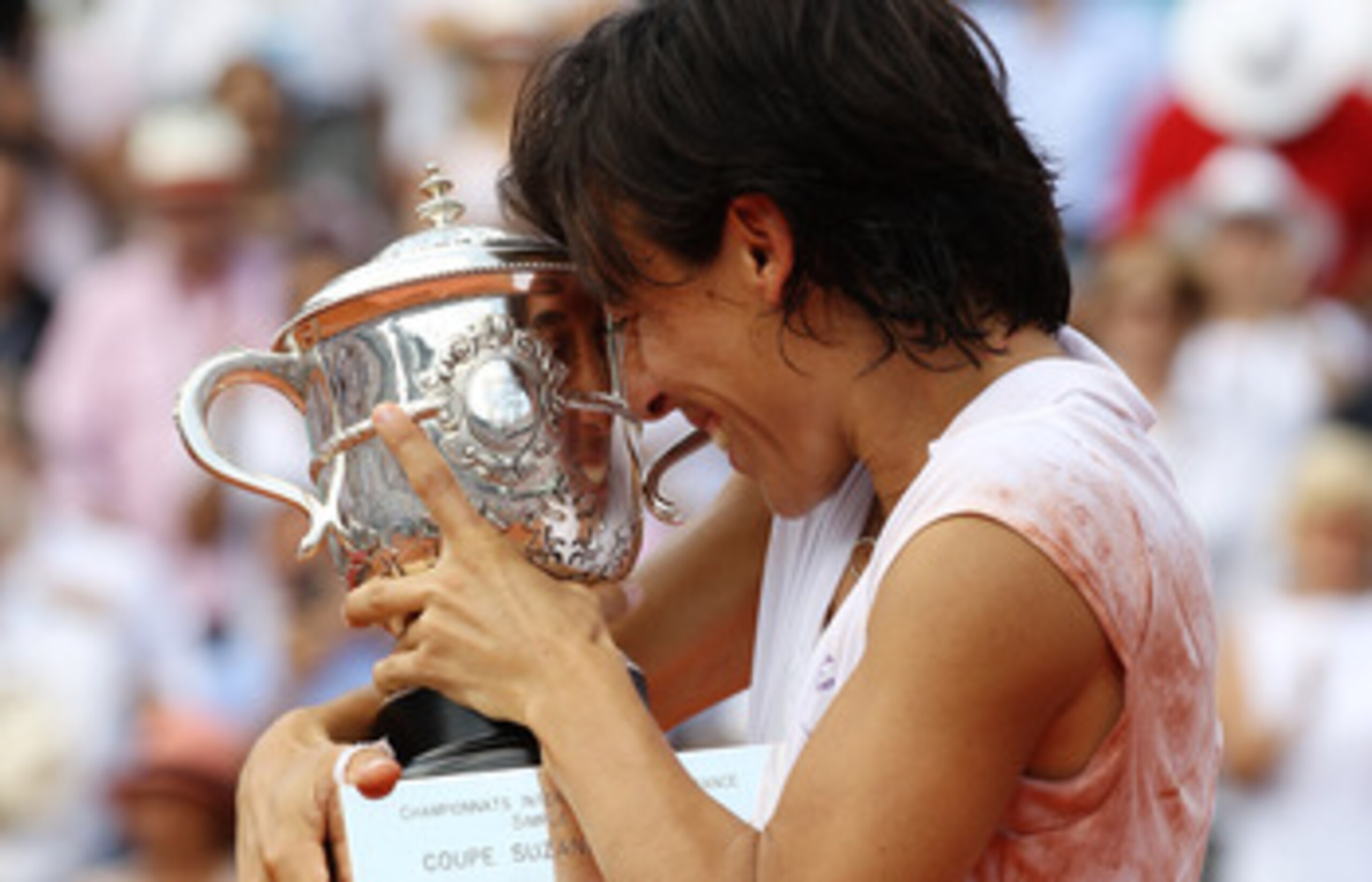 PARIS - JUNE 05:  Francesca Schiavone of Italy celebrates with the trophy after winning the women's singles final match between Francesca Schiavone of Italy and Samantha Stosur of Australia on day fourteen of the French Open at Roland Garros on June 5, 20