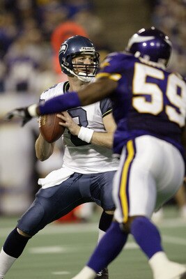 MINNEAPOLIS - DECEMBER 7:  Quarterback Matt Hasselbeck #8 of the Seattle Seahawks looks to get rid of the ball as linebacker Michael Nattiel #59 of the Minnesota Vikings on December 7, 2003 at the Hubert H. Humphrey Metrodome in Minneapolis, Minnesota. Th