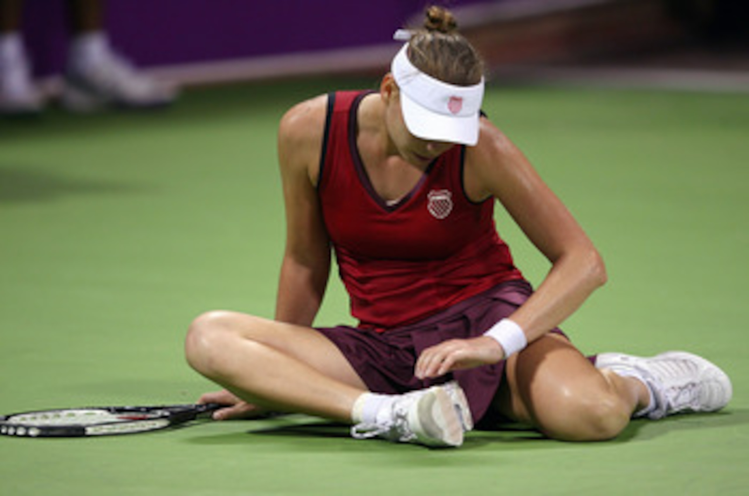DOHA, QATAR - OCTOBER 29:  Vera Zvonareva of Russia shows her dejection against Caroline Wozniacki of Denmark in their round robin match during the Sony Ericsson Championships at the Khalifa Tennis and Squash Complex on October 29, 2009 in Doha, Qatar.  (