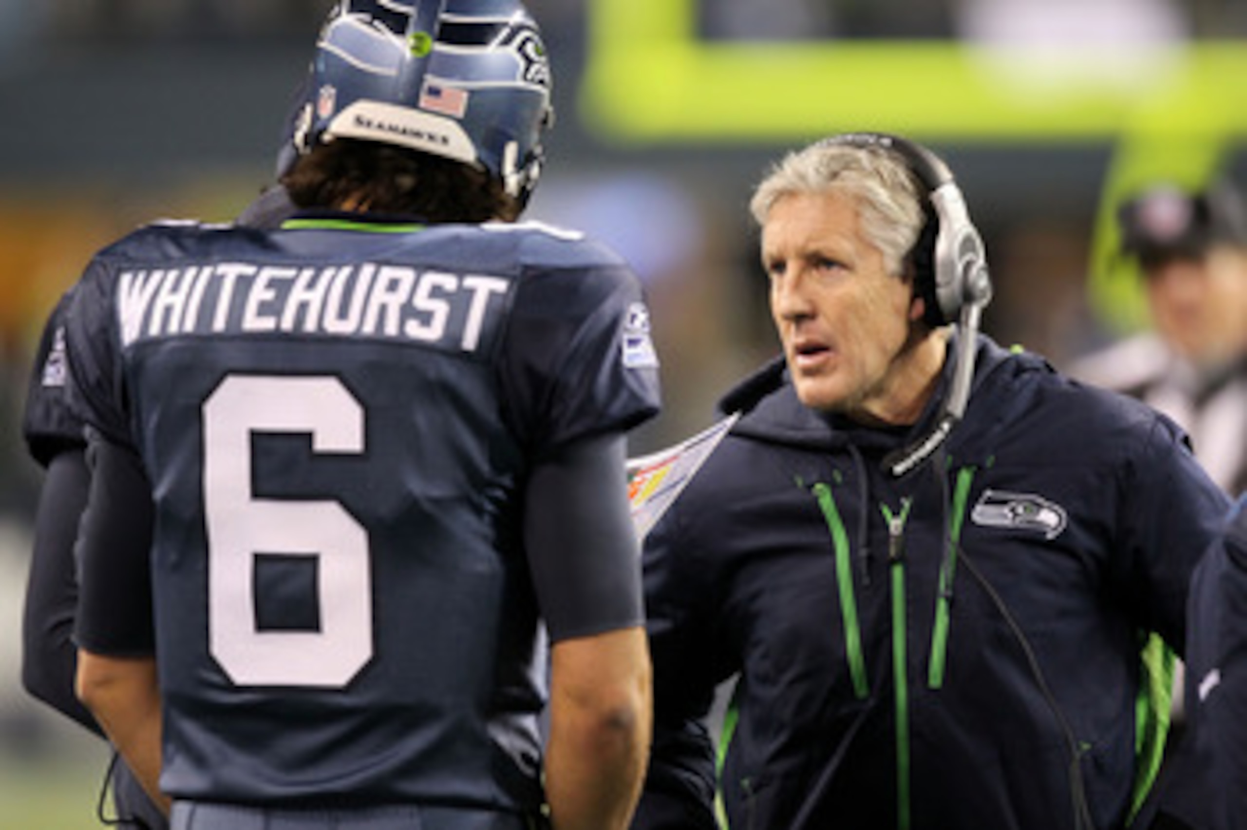 SEATTLE, WA - JANUARY 02:  Head coach Pete Carroll of the Seattle Seahawks talks with quarterback Charlie Whitehurst #6 during their game against the St. Louis Rams at Qwest Field on January 2, 2011 in Seattle, Washington.  (Photo by Otto Greule Jr/Getty