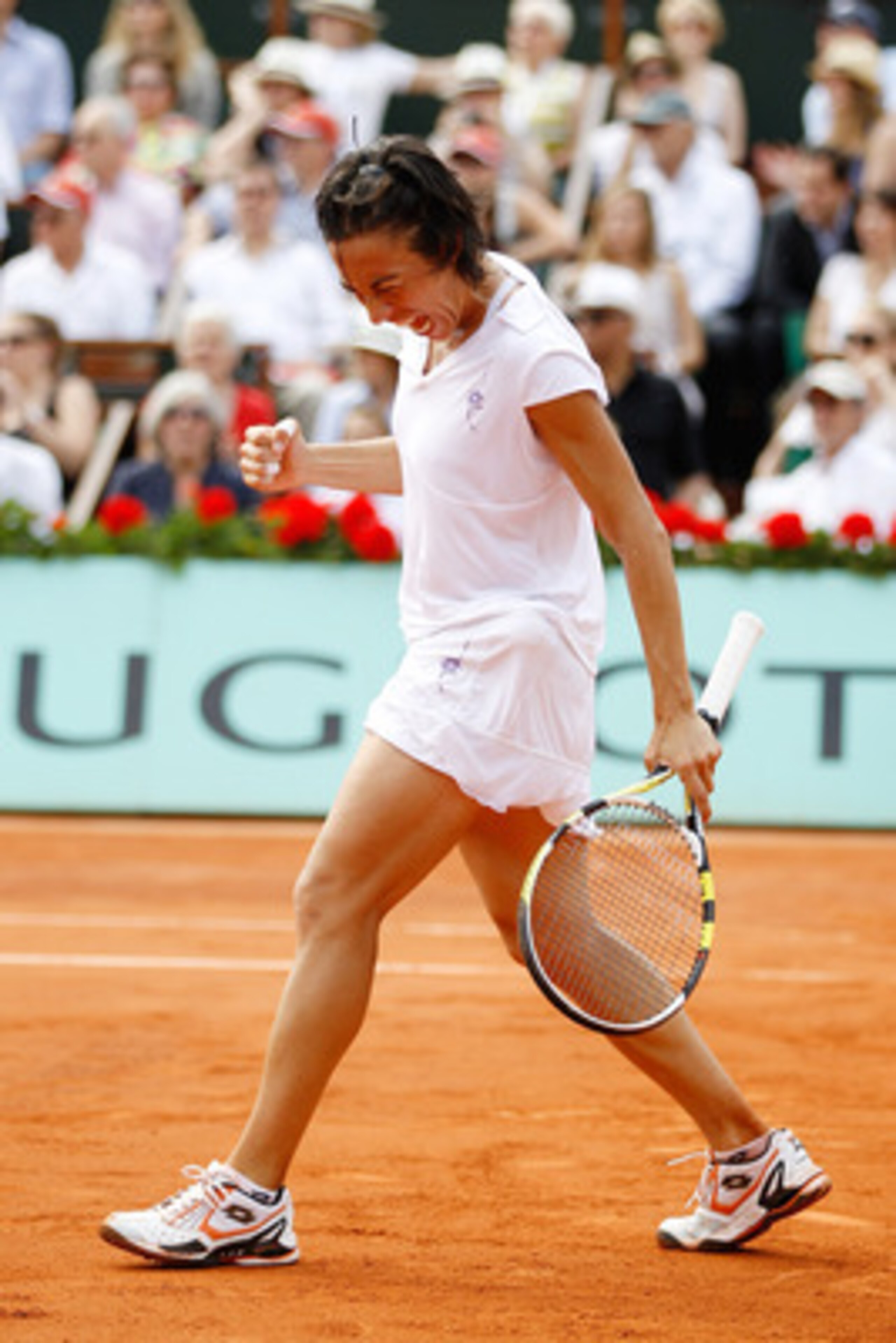PARIS - JUNE 05:  Francesca Schiavone of Italy celebrates winning a point during the women's singles final match between Francesca Schiavone of Italy and Samantha Stosur of Australia on day fourteen of the French Open at Roland Garros on June 5, 2010 in P