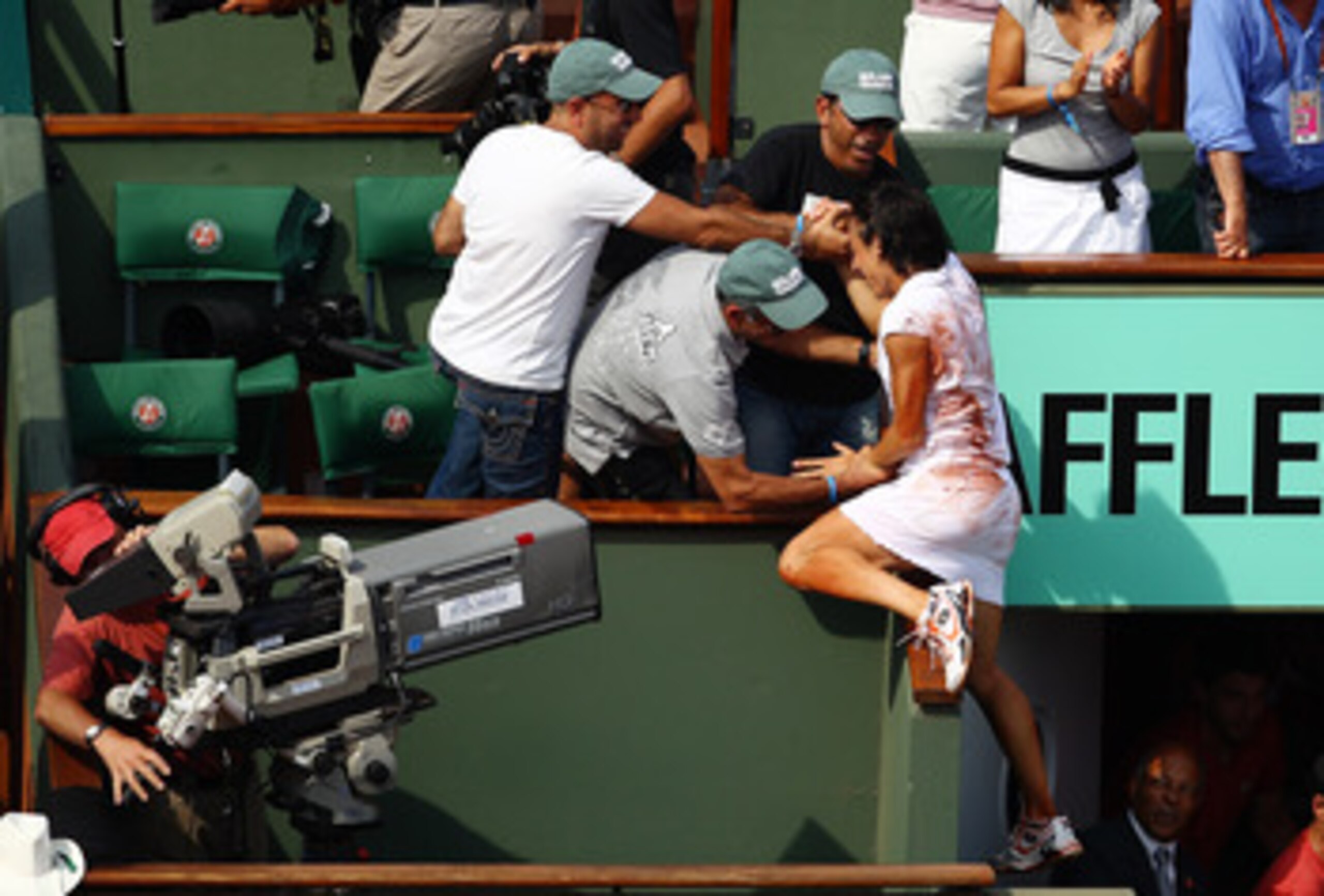 PARIS - JUNE 05:  Francesca Schiavone of Italy celebrates with her team after winning the women's singles final match between Francesca Schiavone of Italy and Samantha Stosur of Australia on day fourteen of the French Open at Roland Garros on June 5, 2010