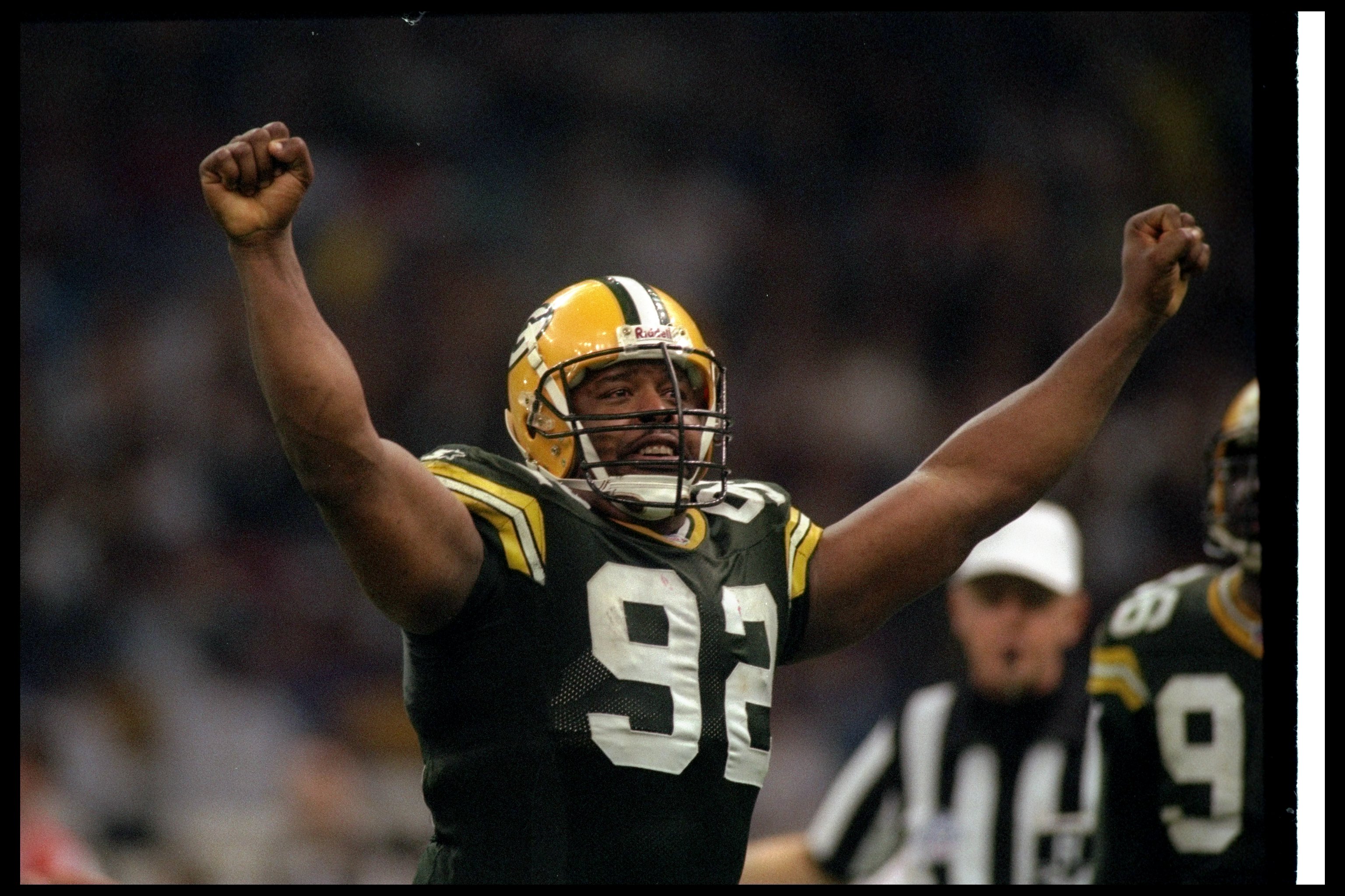 26 Jan 1997:  Defensive lineman Reggie White of the Green Bay Packers celebrates after sacking New England Patriots quarterback Drew Bledsoe during Super Bowl XXXI at the Superdome in New Orleans, Louisiana.  The Packers won the game, 35-21. Mandatory Cre