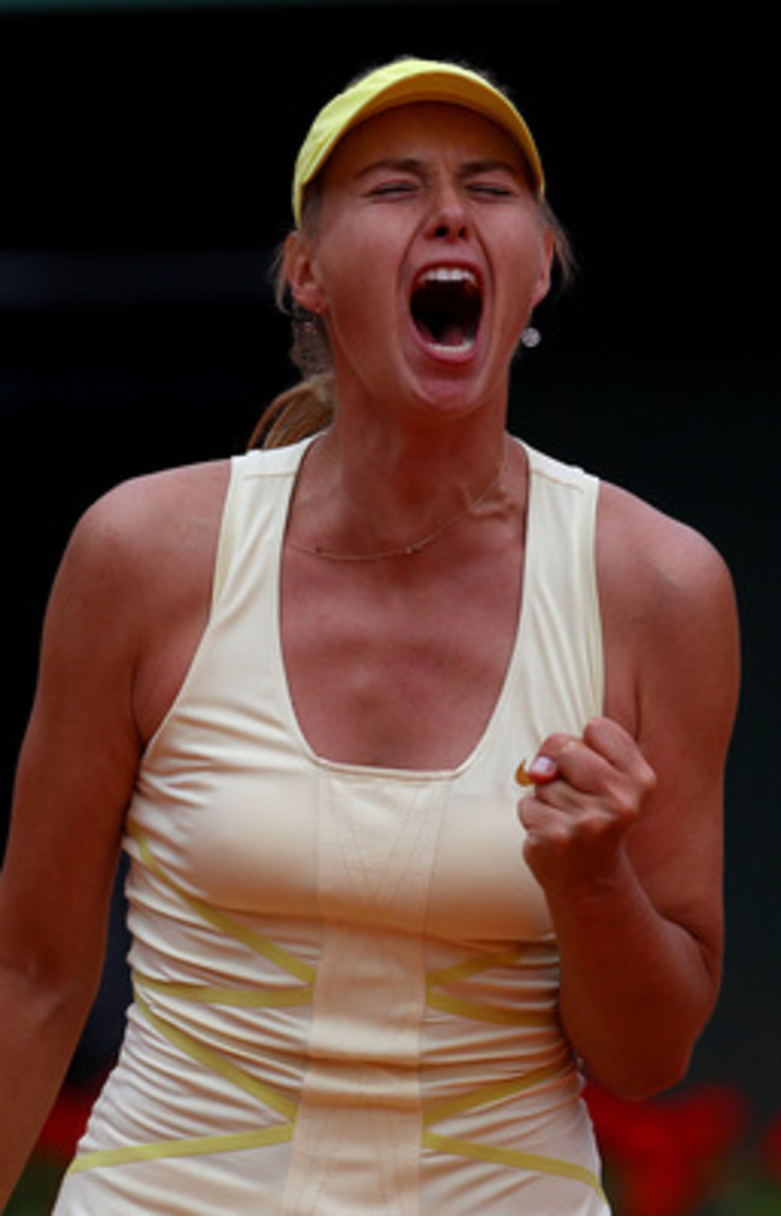 PARIS, FRANCE - MAY 26:  Maria Sharapova of Russia celebrates a point during the women's singles round two match between Maria Sharapova of Russia and Caroline Garcia of France on day five of the French Open at Roland Garros on May 26, 2011 in Paris, Fran