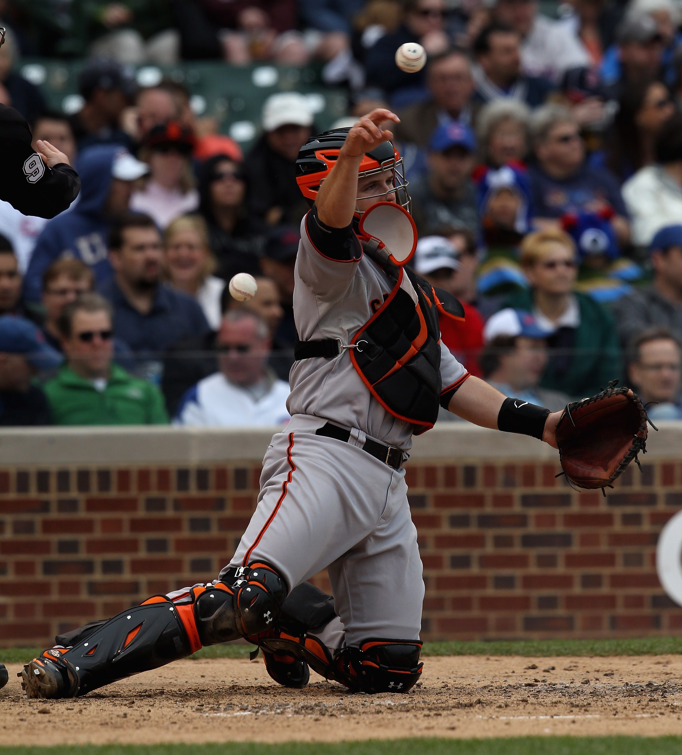 CHICAGO, IL - MAY 13: Buster Posey #28 of the San Francisco Giants throws to the pitcher against the Chicago Cubs at Wrigley Field on May 13, 2011 in Chicago, Illinois. The Cubs defeated the Giants 11-4.  (Photo by Jonathan Daniel/Getty Images)