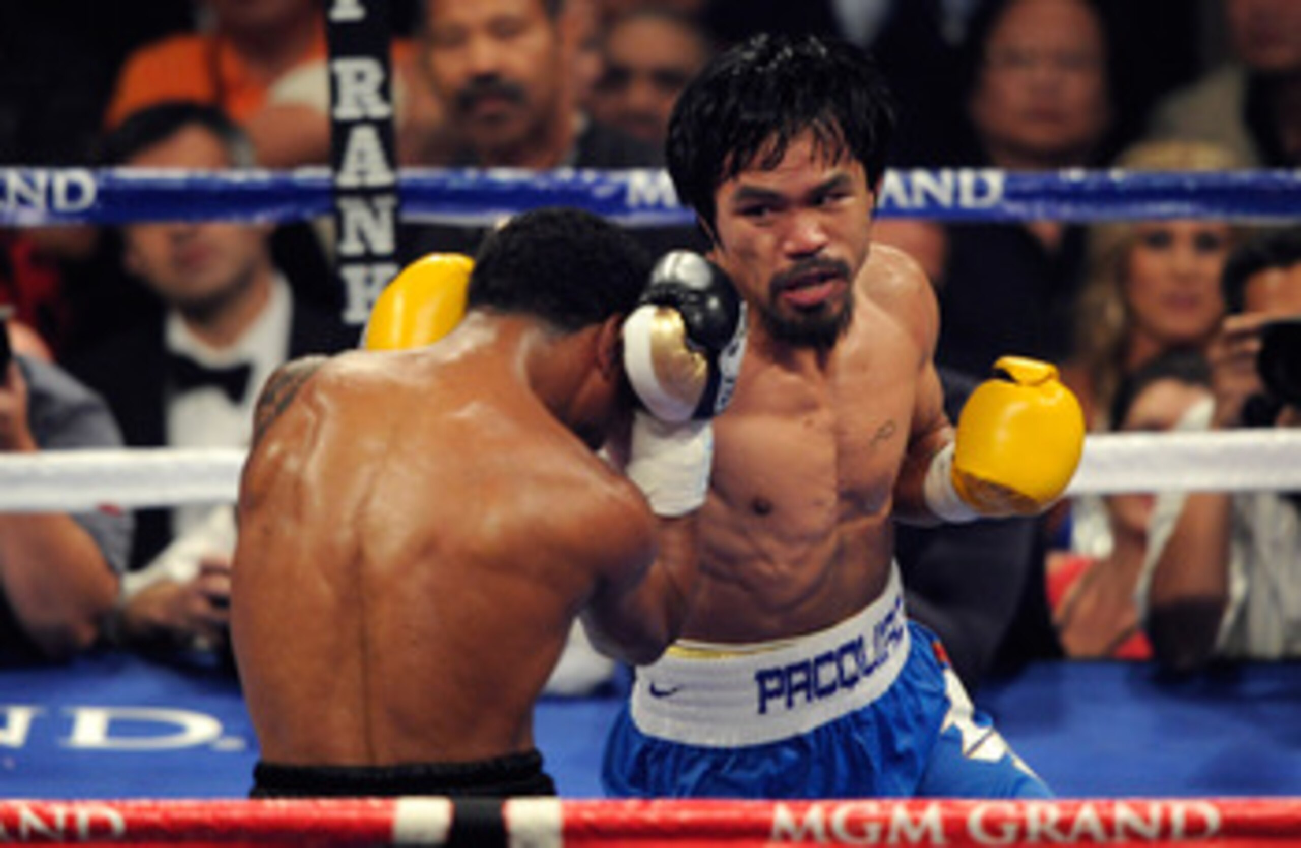 LAS VEGAS, NV - MAY 07:  (R-L) Manny Pacquiao of the Philippines throws a right at Shane Mosley in the WBO welterweight title fight at MGM Grand Garden Arena on May 7, 2011 in Las Vegas, Nevada.  (Photo by Ethan Miller/Getty Images)