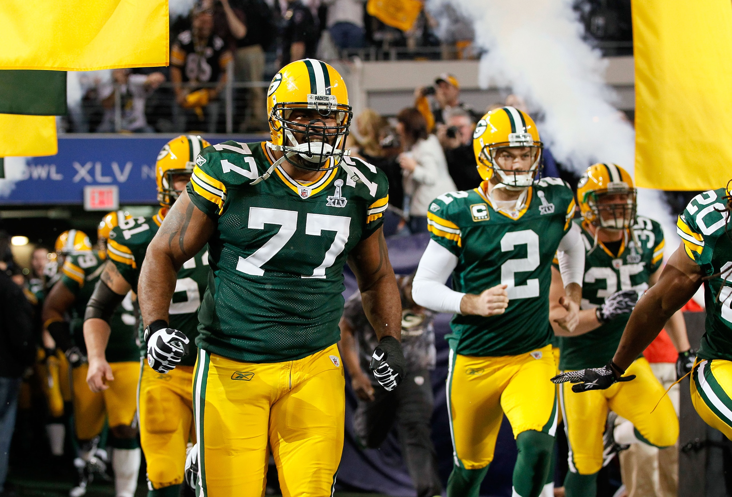 ARLINGTON, TX - FEBRUARY 06: Cullen Jenkins #77 and Mason Crosby #2 of the Green Bay Packers run onto the field prior to Super Bowl XLV at Cowboys Stadium on February 6, 2011 in Arlington, Texas. (Photo by Kevin C. Cox/Getty Images) ARLINGTON, TX - FEBRUARY 06: Cullen Jenkins #77 and Mason Crosby #2 of the Green Bay Packers run onto the field prior to Super Bowl XLV at Cowboys Stadium on February 6, 2011 in Arlington, Texas. (Photo by Kevin C. Cox/Getty Images)