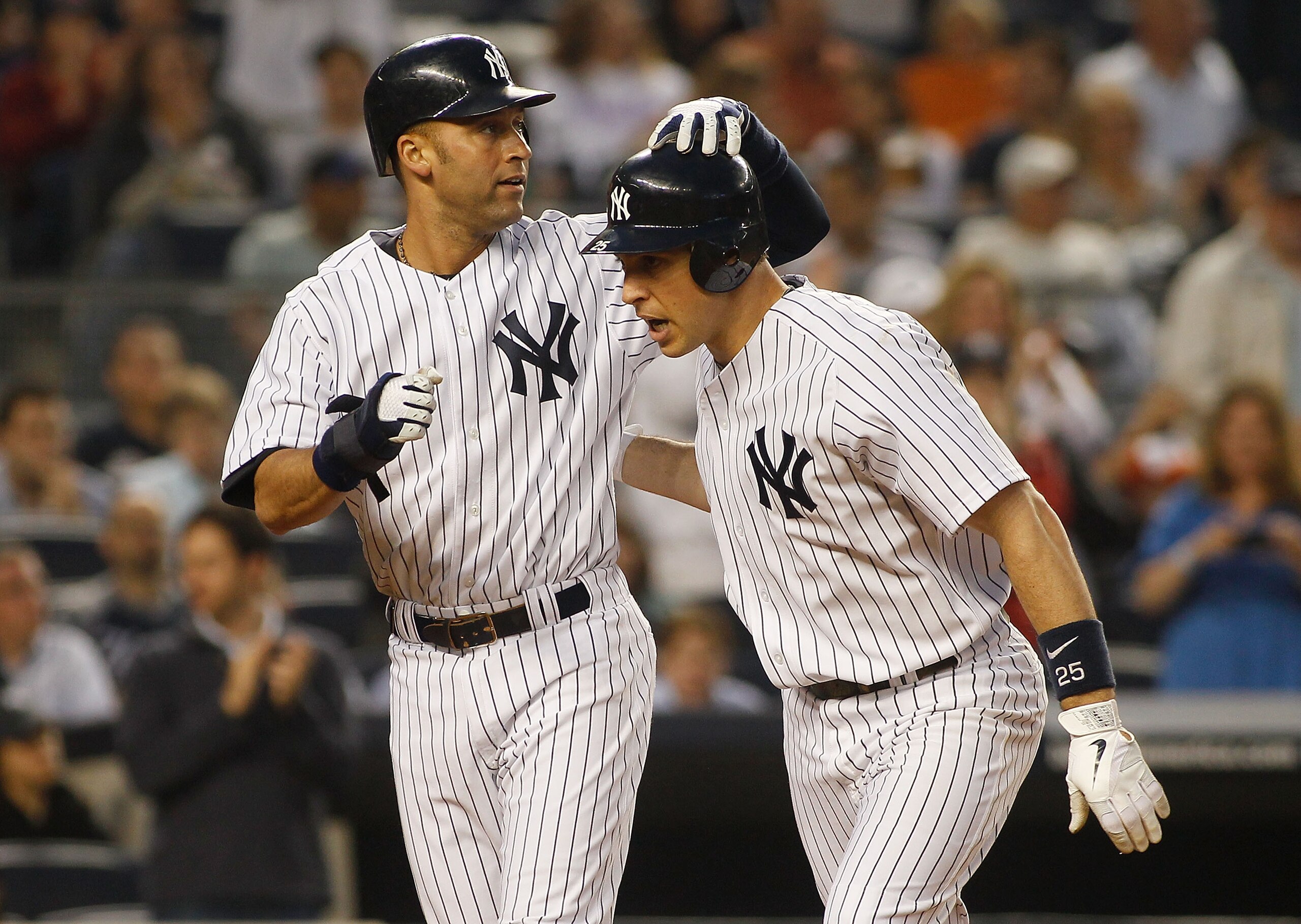 NEW YORK - MAY 21:  Mark Teixeira #25 of the New York Yankees is congradulated by teammate Derek Jeter #2 after hitting a two run homerun in the bottom of the third inning against the New York Mets on May 21, 2011 at Yankee Stadium in the Bronx borough of