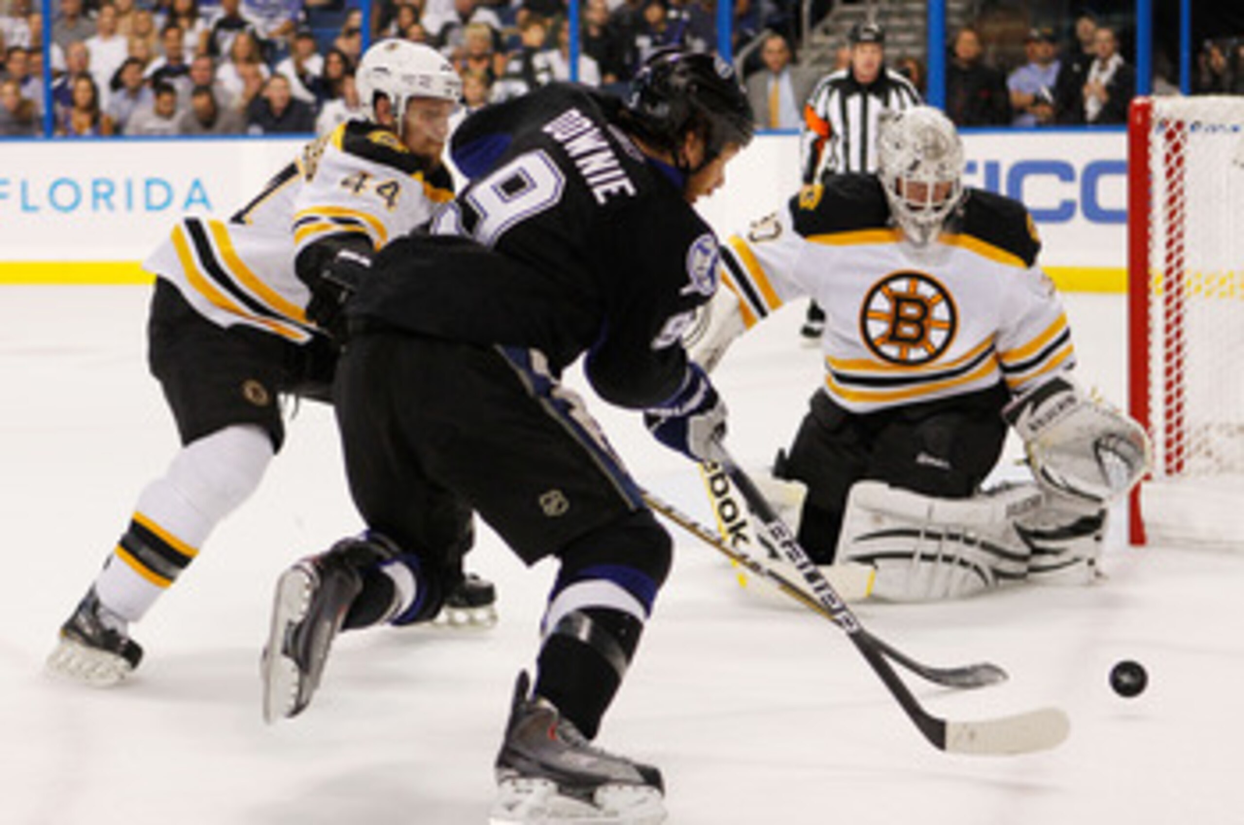 TAMPA, FL - MAY 25:  Dennis Seidenberg #44 and Tim Thomas #30 of the Boston Bruins defend against Steve Downie #9 of the Tampa Bay Lightning in Game Six of the Eastern Conference Finals during the 2011 NHL Stanley Cup Playoffs at St Pete Times Forum on Ma