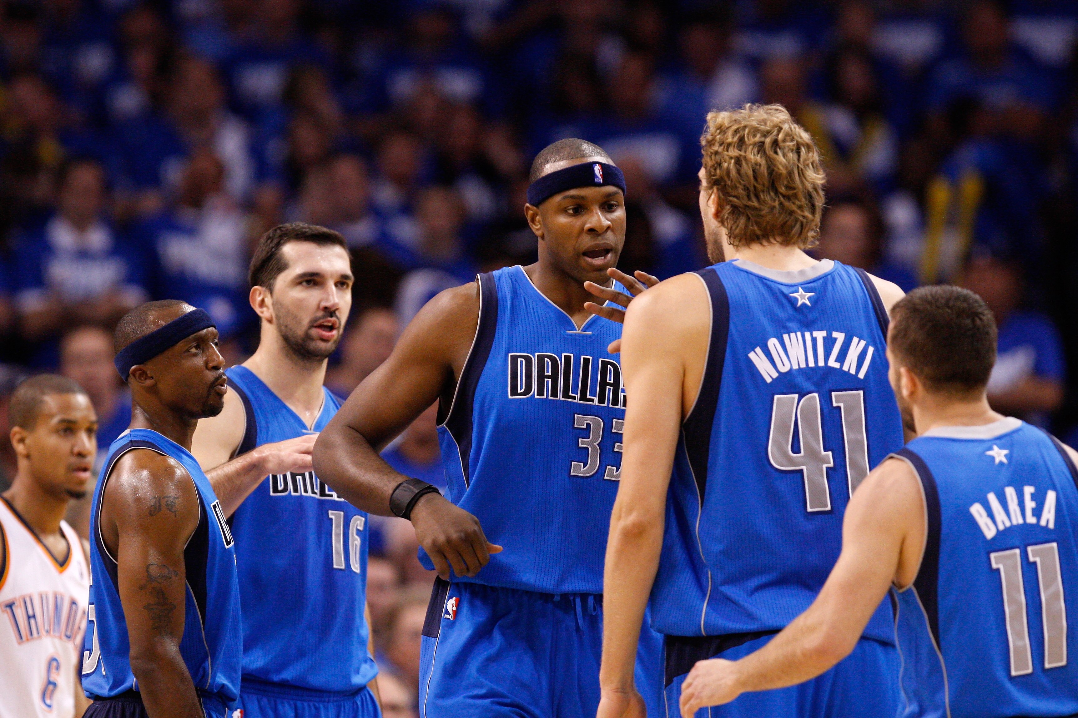 OKLAHOMA CITY, OK - MAY 21:  (L-R) Jason Terry #31, Peja Stojakovic #16, Brendan Haywood #33, Dirk Nowitzki #41 and Jose Juan Barea #11 of the Dallas Mavericks celebrate on the court in the second quarter while taking on the Oklahoma City Thunder in Game