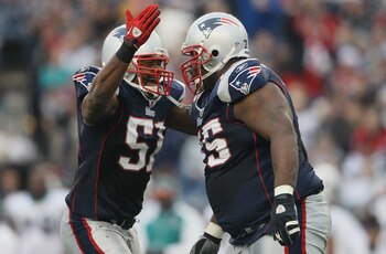 FOXBORO, MA - JANUARY 02: Jerod Mayo #51 of the New England Patriots congratulates Vince Wilfork #75 in the second half against the Miami Dolphins on January 2, 2011 at Gillette Stadium in Foxboro, Massachusetts. (Photo by Elsa/Getty Images) FOXBORO, MA - JANUARY 02: Jerod Mayo #51 of the New England Patriots congratulates Vince Wilfork #75 in the second half against the Miami Dolphins on January 2, 2011 at Gillette Stadium in Foxboro, Massachusetts. (Photo by Elsa/Getty Images)