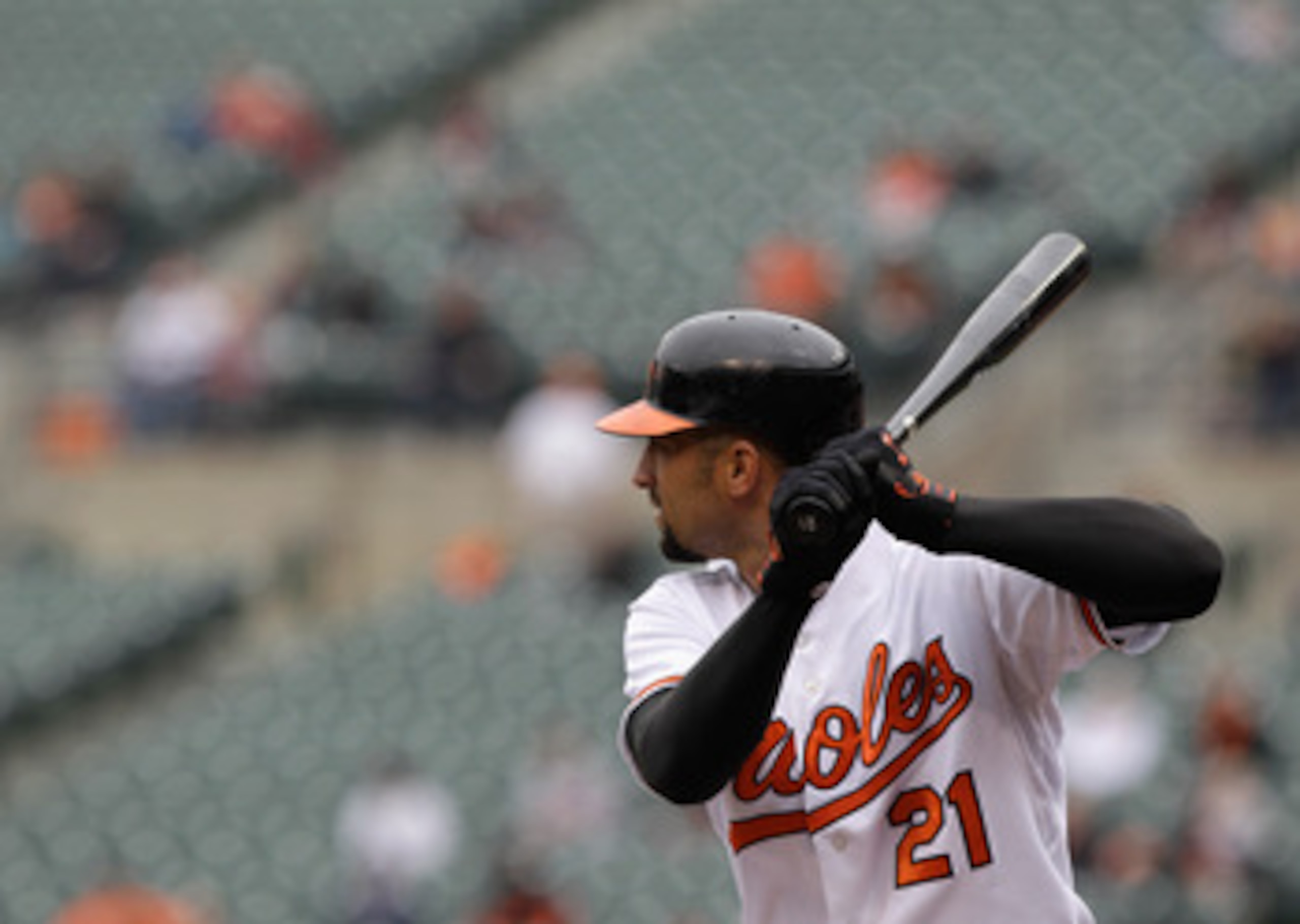 BALTIMORE, MD - APRIL 10: Nick Markakis #21 of the Baltimore Orioles at the plate against the Texas Rangers at Oriole Park at Camden Yards on April 10, 2011 in Baltimore, Maryland.  (Photo by Rob Carr/Getty Images)