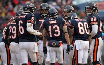 CHICAGO, IL - JANUARY 16:  Jay Cutler #6 of the Chicago Bears huddles with his team against the Seattle Seahawks in the 2011 NFC divisional playoff game at Soldier Field on January 16, 2011 in Chicago, Illinois.  (Photo by Doug Pensinger/Getty Images)