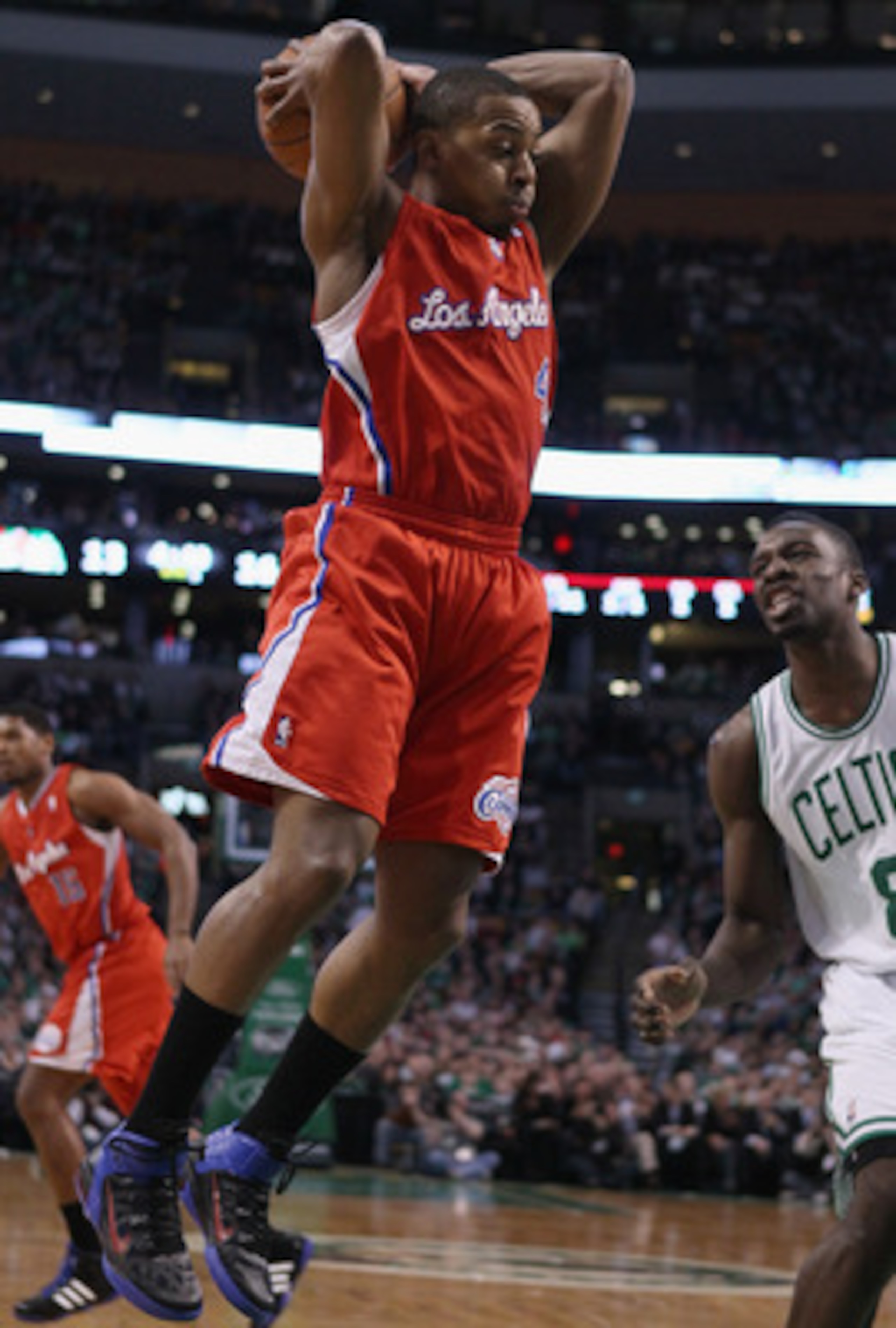BOSTON, MA - MARCH 09:  Randy Foye #4 of the Los Angeles Clippers grabes the rebound before Jeff Green #8 of the Boston Celtics on March 9, 2011 at the TD Garden in Boston, Massachusetts. NOTE TO USER: User expressly acknowledges and agrees that, by downl