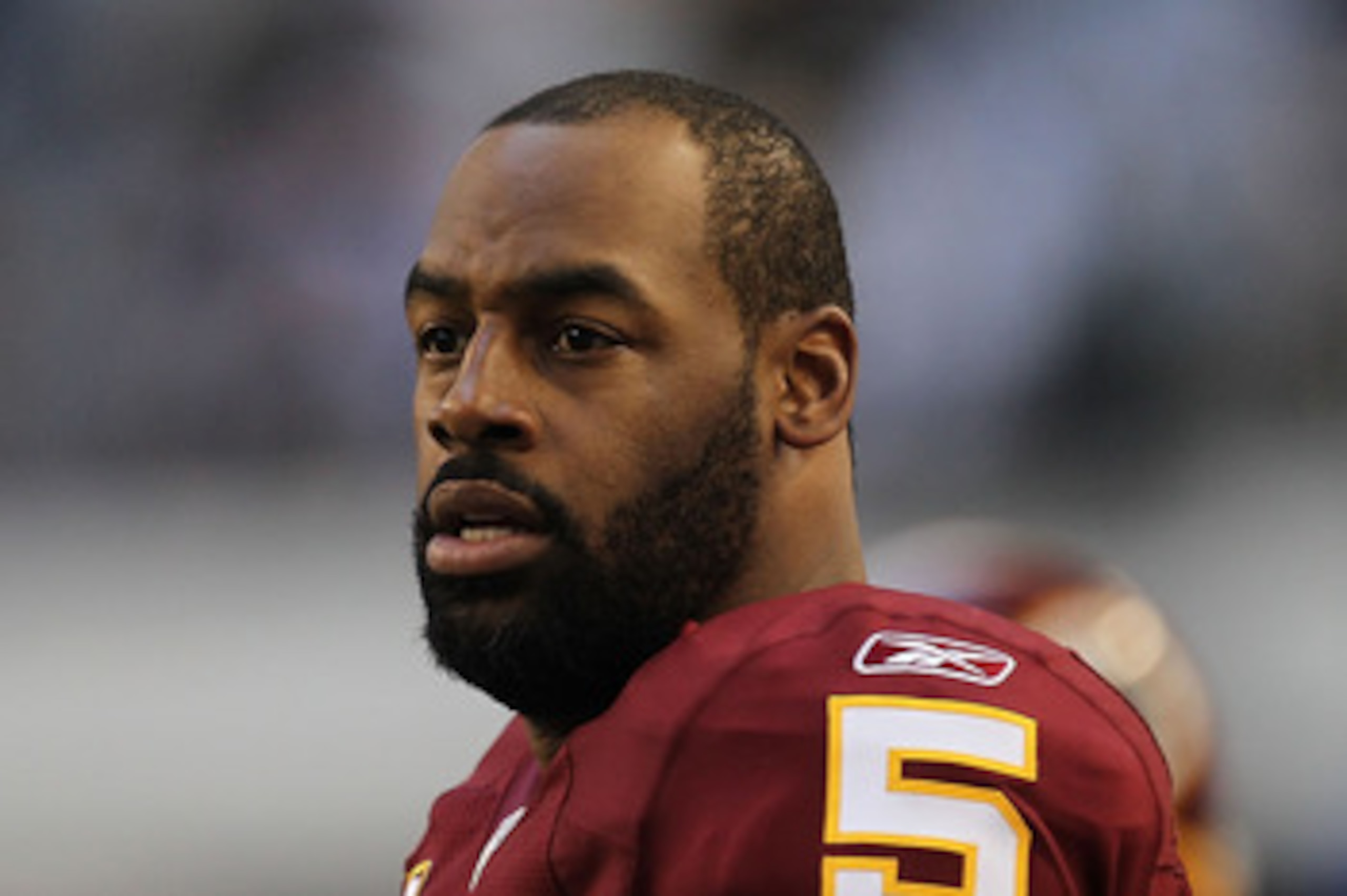 ARLINGTON, TX - DECEMBER 19:  Quarterback Donovan McNabb #5  of the Washington Redskins on the sidelines against play against the Dallas Cowboys at Cowboys Stadium on December 19, 2010 in Arlington, Texas.  (Photo by Ronald Martinez/Getty Images)