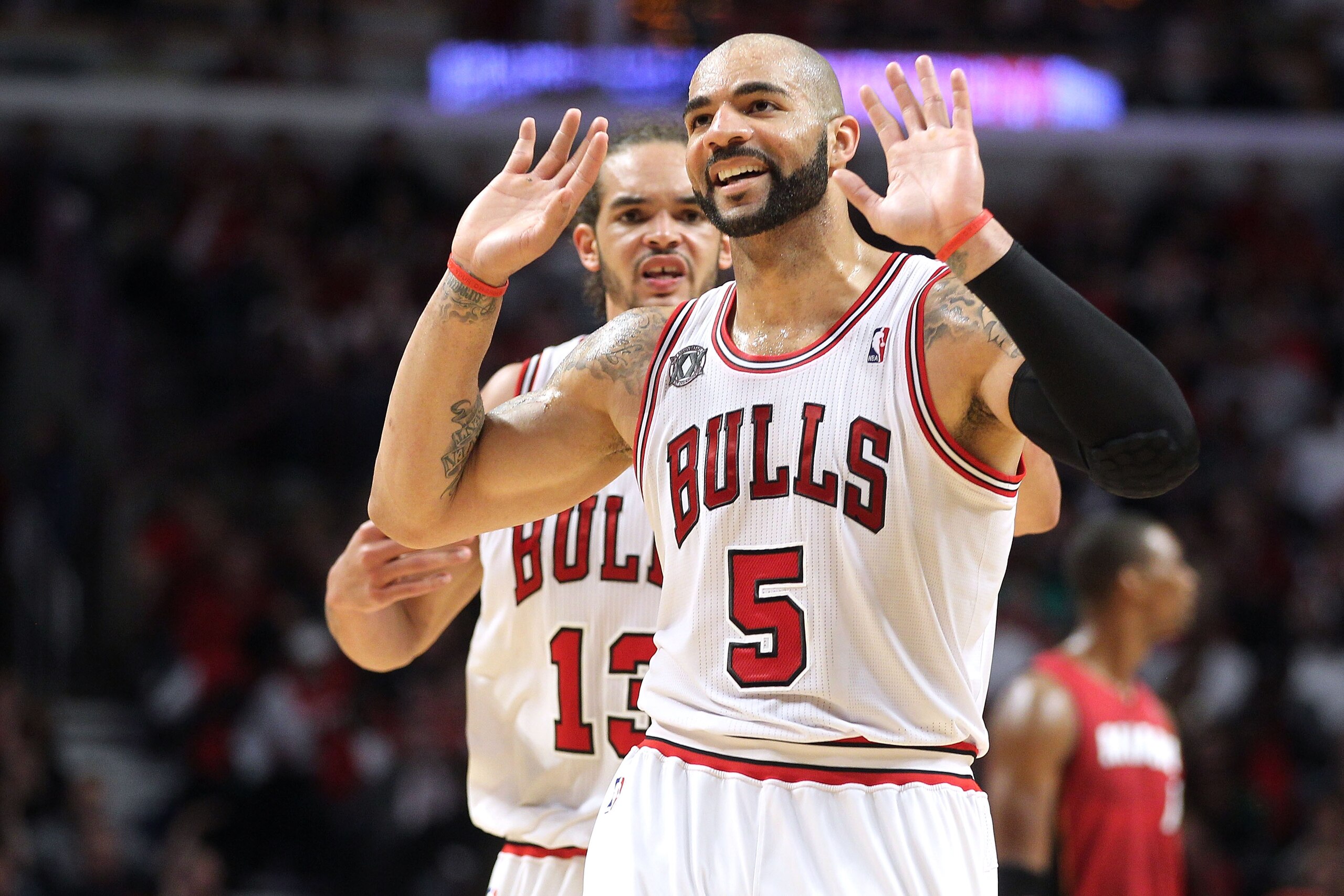 CHICAGO, IL - MAY 26:  Carlos Boozer #5 and Joakim Noah #13 of the Chicago Bulls looks on against the Miami Heat in Game Five of the Eastern Conference Finals during the 2011 NBA Playoffs on May 26, 2011 at the United Center in Chicago, Illinois. The Heat