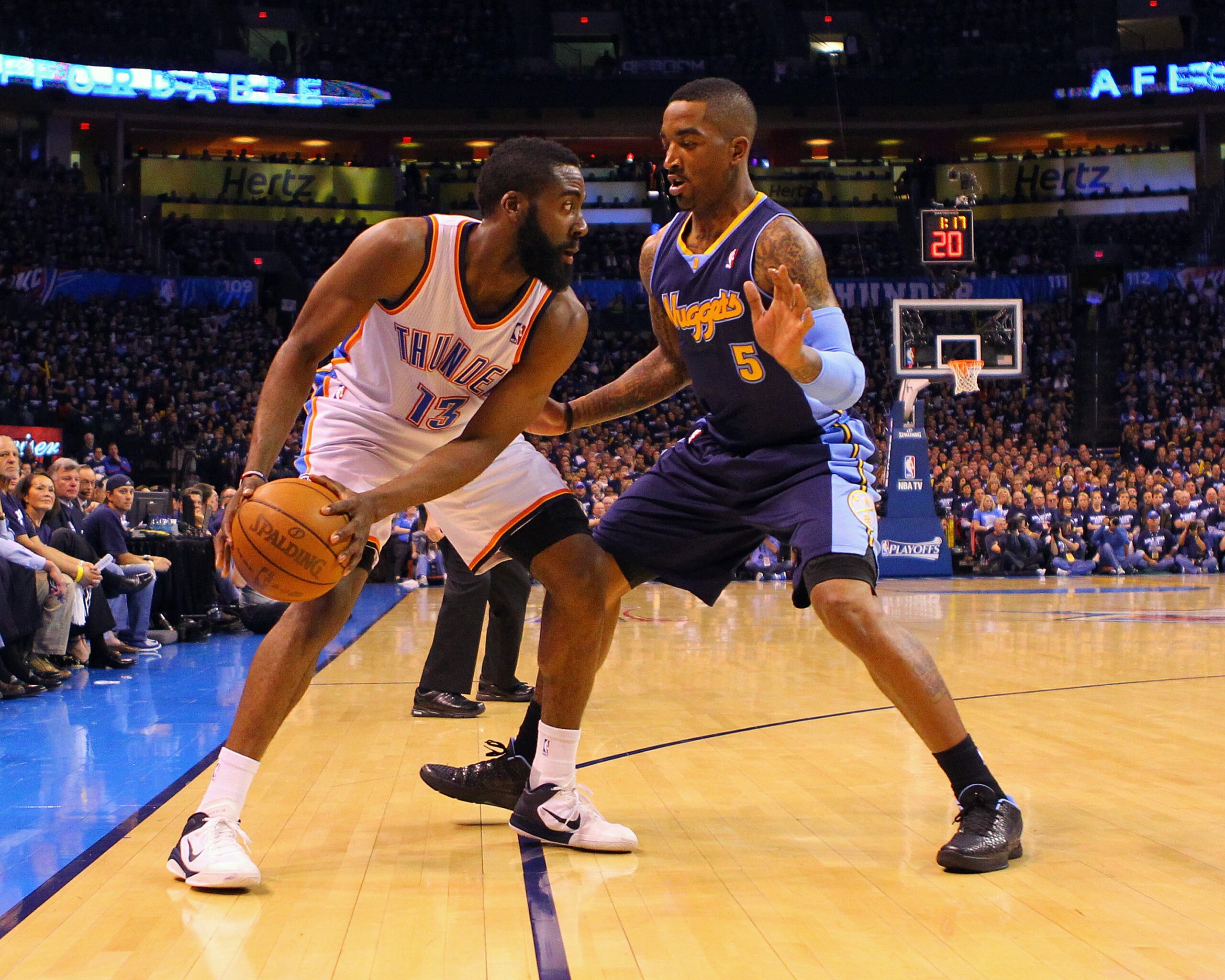 OKLAHOMA CITY, OK - APRIL 27: J.R. Smith #5 of the Denver Nuggets defends against James Harden #13 of the Oklahoma City Thunder in Game Five of the Western Conference Quarterfinals in the 2011 NBA Playoffs on April 27, 2011 at the Ford Center in Oklahoma