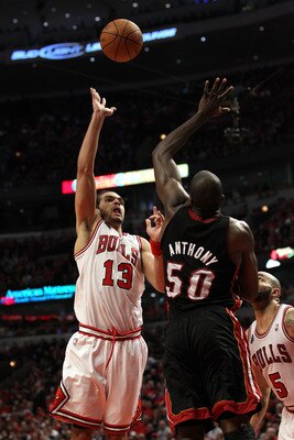CHICAGO, IL - MAY 15: Joakim Noah #13 of the Chicago Bulls attempts a shot against Joel Anthony #50 of the Miami Heat in Game One of the Eastern Conference Finals during the 2011 NBA Playoffs on May 15, 2011 at the United Center in Chicago, Illinois. NOTE